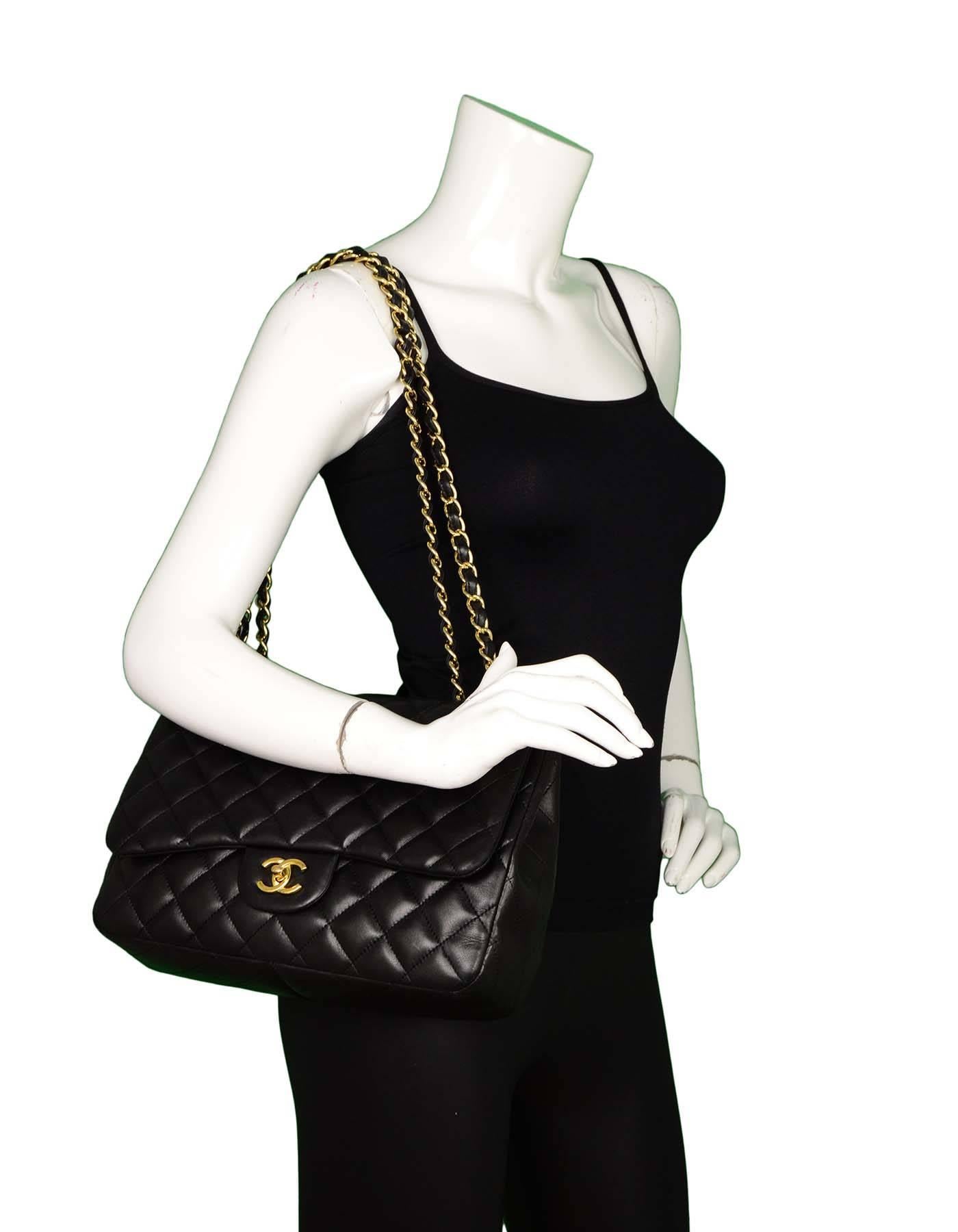 Chanel Black Jumbo Lambskin Single Flap Bag
Features adjustable shoulder strap and quilting throughout

Made In: Italy
Year of Production: 2010
Color: Black
Hardware: Goldtone
Materials: Lambskin
Lining: Burgundy leather
Closure/Opening: