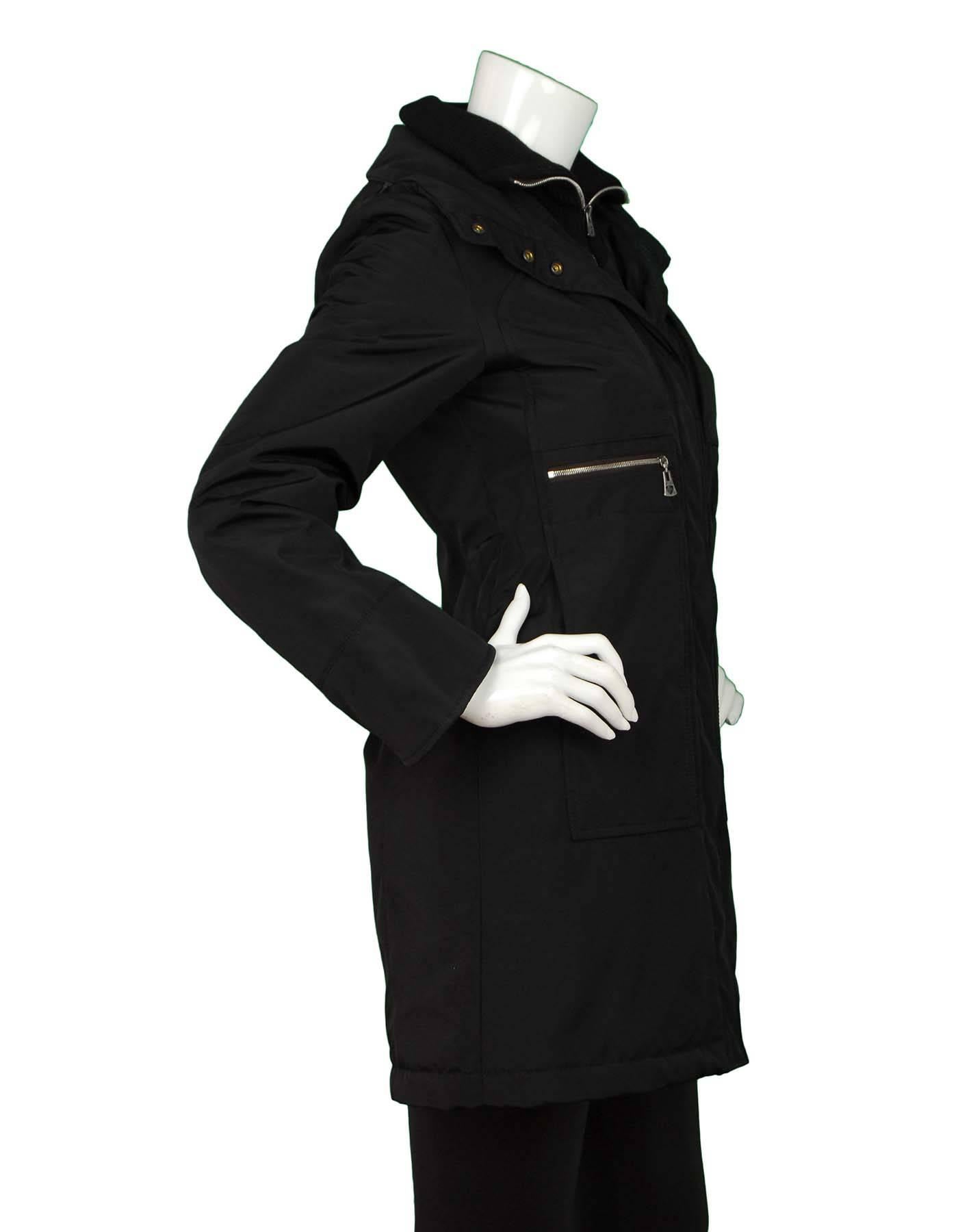 Postcard Black City Coat Sz 0
Features optional hood

Made In: Bulgaria
Color: Black
Composition: 65% Polyester, 30% nylon, 5% polyurethan
Lining: Brown 100% Nylon
Closure/Opening: Front zip and button closure
Exterior Pockets: Two hip