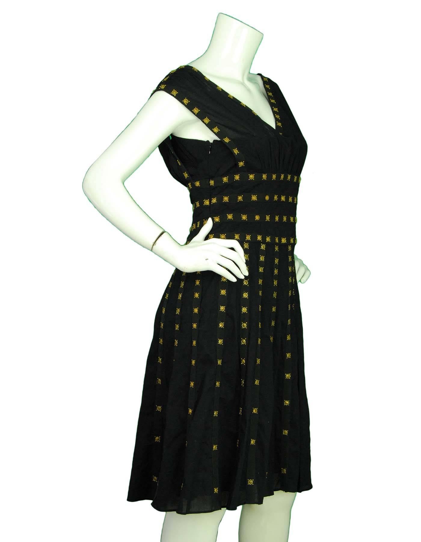 Temperly London Black Beaded Dress Sz 10

Features goltone beading throughout

Made In: India
Color: Black and gold
Composition: 100% Cotton
Lining: Black 100% Silk
Closure/Opening: Hidden side zip closure
Overall Condition: Excellent