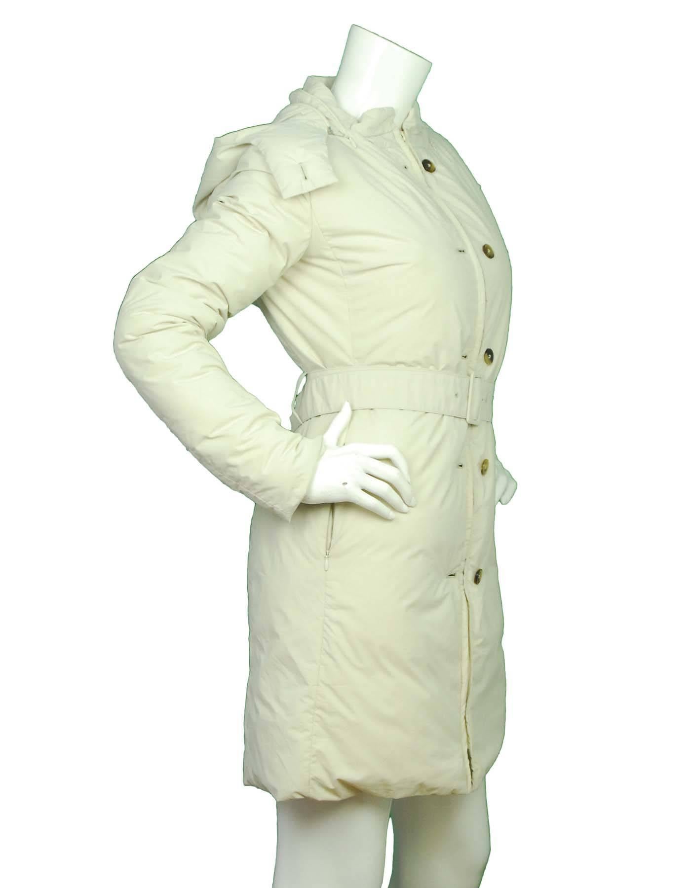 Jil Sander Beige Down Coat Sz 36
Features optional hood

Made In: Italy
Color: Beige
Composition: 90% Polyester, 10% Polyurethane
Lining: Cream 100% Silk
Closure/Opening: Front zip closure
Exterior Pockets: Two hip zip pockets
Interior