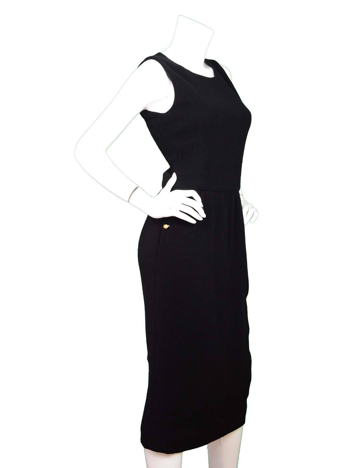 Chanel Black Sleeveless Long Dress

Color: Black
Composition: Not listed, believed to be wool blend
Lining: Black lining
Closure/Opening: Back zip closure
Exterior Pockets: Two side pockets with button detail
Overall Condition: Very good