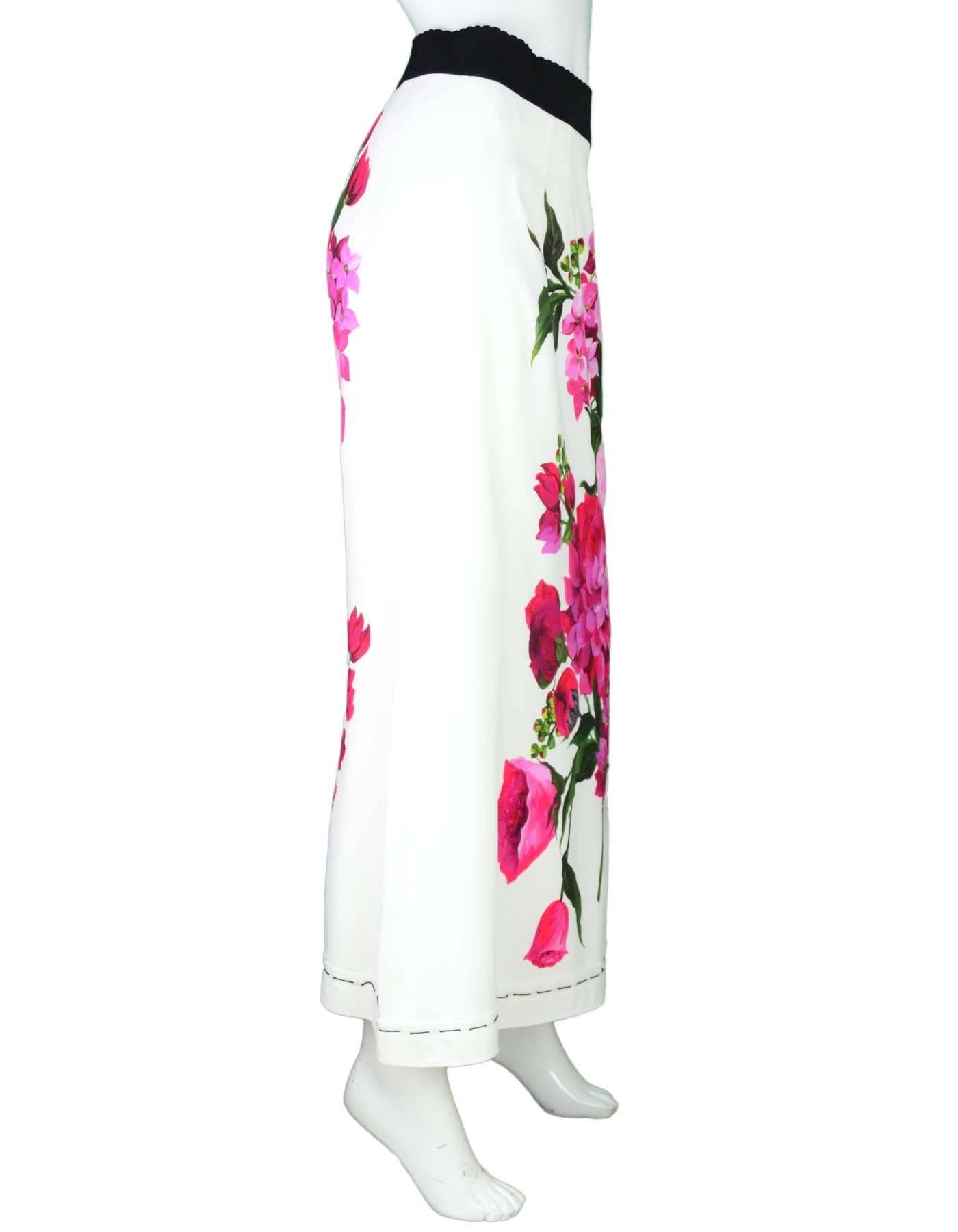  Dolce & Gabbana White Skirt with Floral Motif Sz 48 NWT

Made In: Italy
Color: Black, white, pink
Composition: 100% Rayon
Lining: White 94% Silk, 6% Elastane
Retail Price: $1,395 + tax
Closure/Opening: Zip closure at back
Overall Condition: