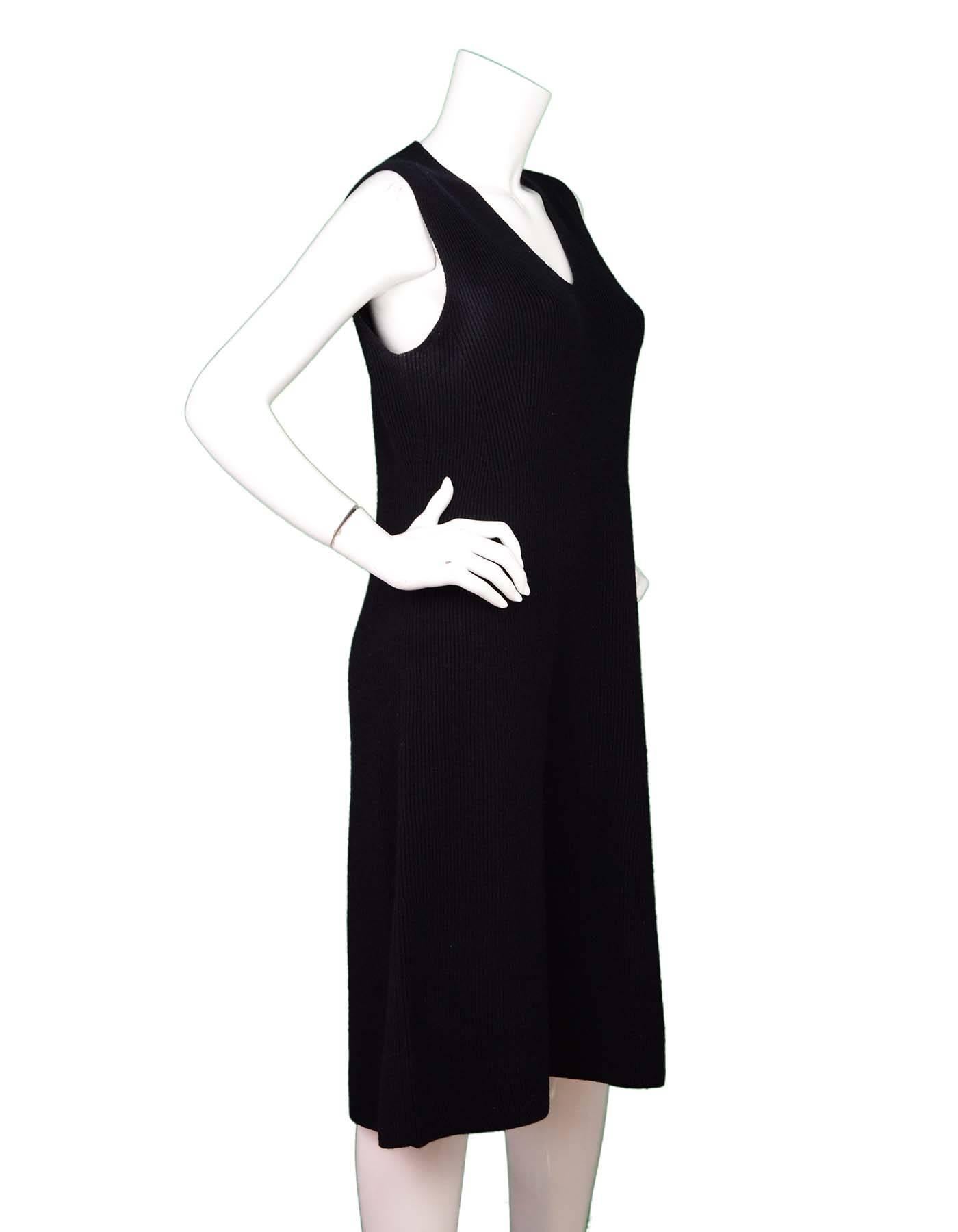 Vince Black Wool V-Neck Dress Sz L

Made In: China
Color: Black
Composition: 91% Wool, 8% Nylon, 1% Spandex
Lining: None
Closure/Opening: Pull-over
Retail Price: $375 + tax
Overall Condition: Excellent pre-owned condition with the exception