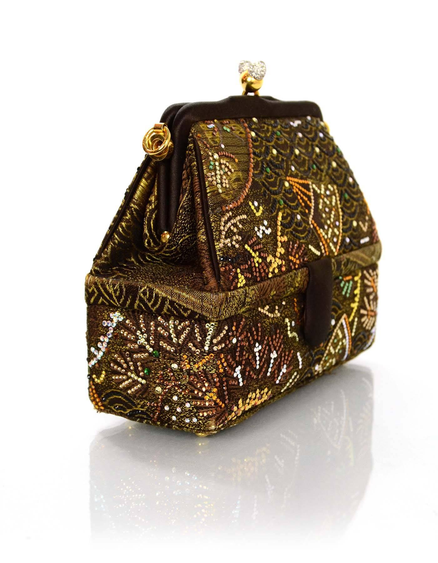 Judith Leiber Embroidered Satin Evening Bag 
Features rhinestone details throughout as well as a detachable satin twist w/tassel shoulder strap
Color: Bronze, burgundy and black
Hardware: Goldtone
Materials: Satin, metal and rhinestones
Lining: