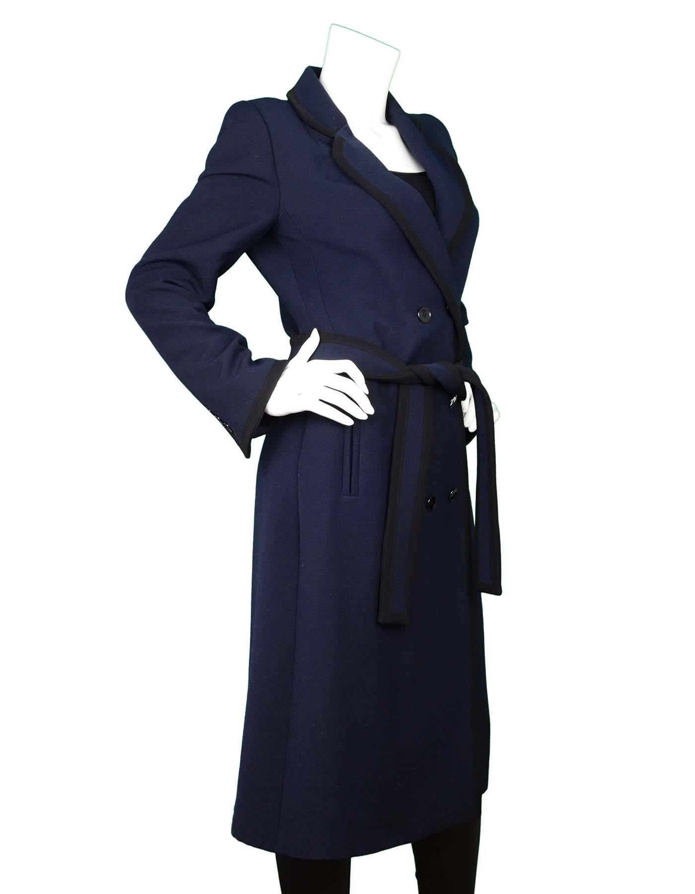 Dolce & Gabbana Navy and Black Wool Coat Sz 40
Features double breast closure

Made In: Italy
Color: Black and navy
Composition: 98% Wool, 2% Nylon
Lining: Black silk
Closure/Opening: Front button closure
Exterior Pockets: Two faux hip