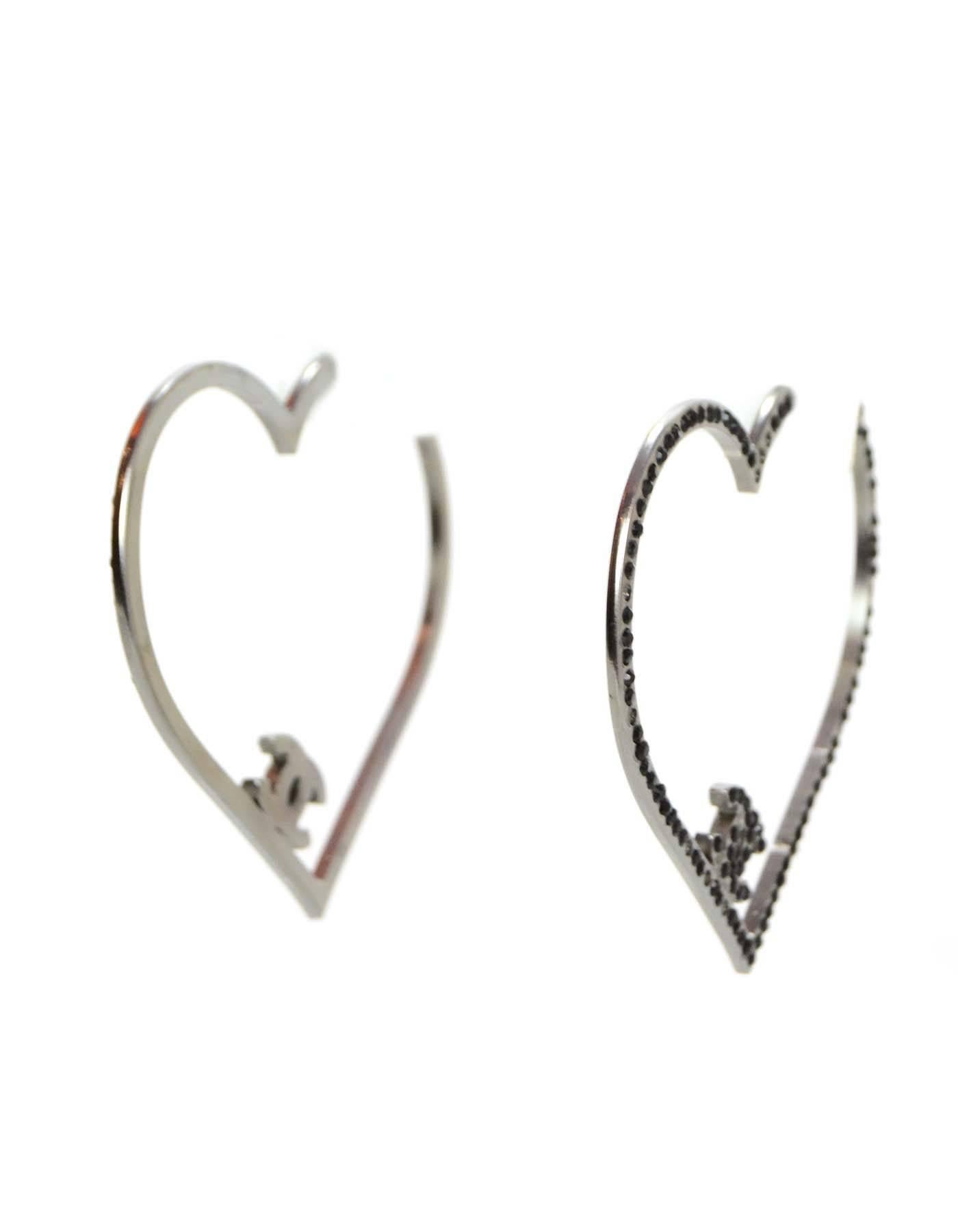 Chanel CC Heart Earrings

Color: Silver and black
Materials: Metal and pave stones
Closure: Pierced
Retail Price: $1,335 + tax
Overall Condition: Very good pre-owned condition with the exception of light surface marks and missing
