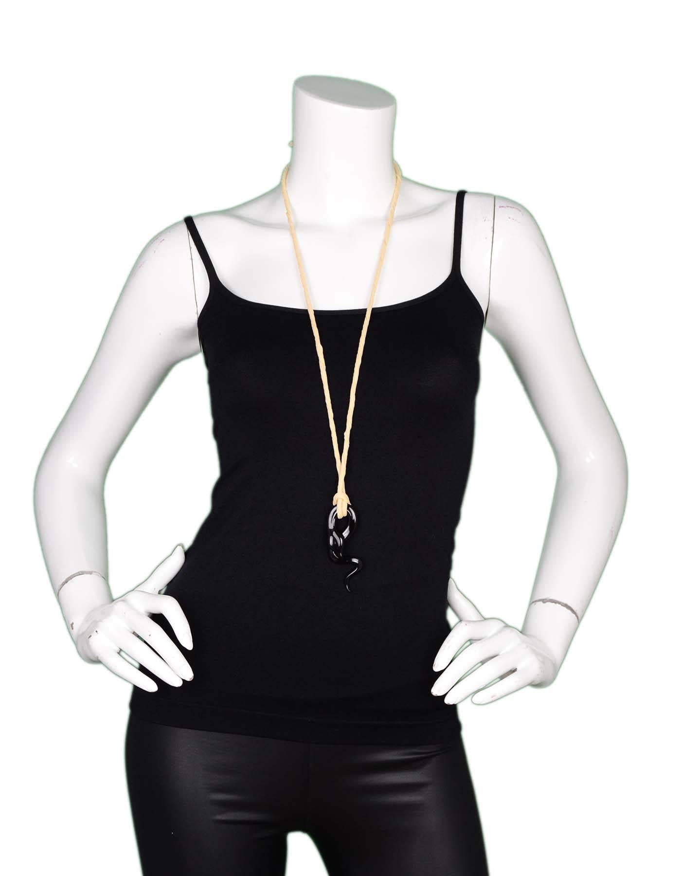 Celine Black Serpent Pendant Necklace

Made In: Italy
Color: Black and nude
Materials: Metal nylon
Retail Price: $590 + tax
Closure: Tie closure
Stamp: Celine Paris Made in France
Overall Condition: Excellent pre-owned condition with the