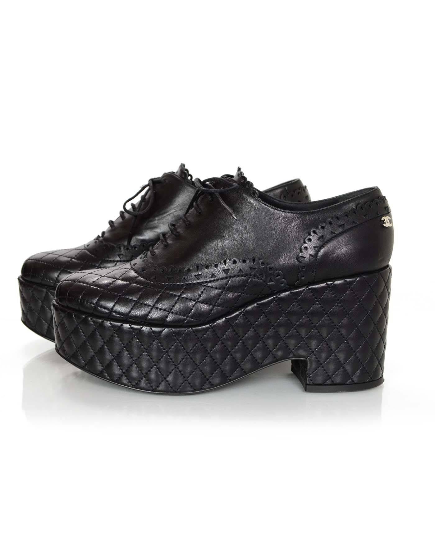 Chanel Black Quilted Oxford Platforms Sz 40.5

Made In: Italy
Color: Black
Materials: Leather
Closure/Opening: Lace tie closure
Sole Stamp: CC Made in Italy 40.5
Overall Condition: Excellent pre-owned condition with the exception of some