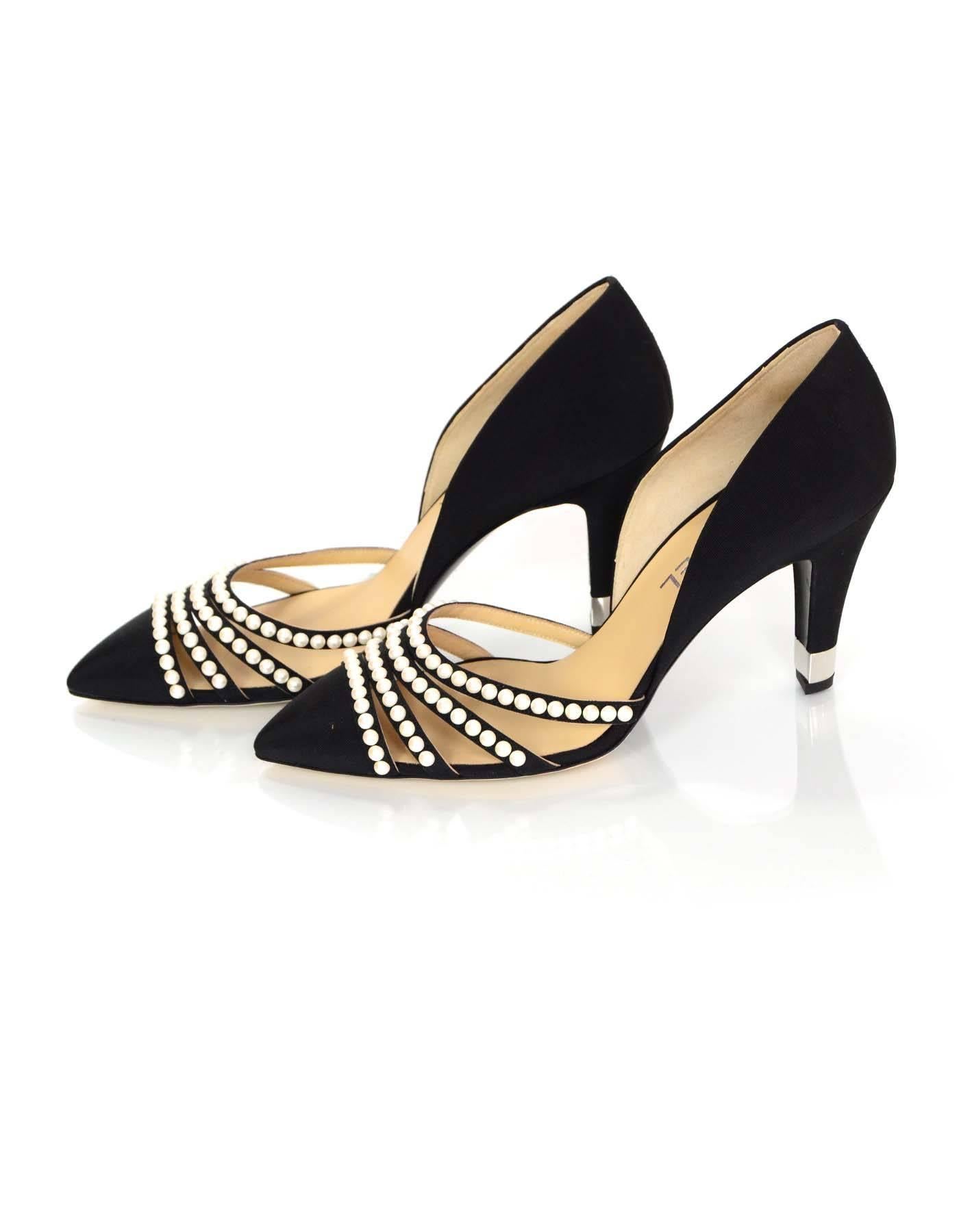 Chanel Black Grosgrain and Faux Pearl D'Orsay Pumps Sz 39.5 NIB
Features pointed toes and faux pearl details

Made In: Italy
Year Of Production: 2016
Color: Black and white
Retail Price: $1,100 + tax
Materials: Grosgrain and faux