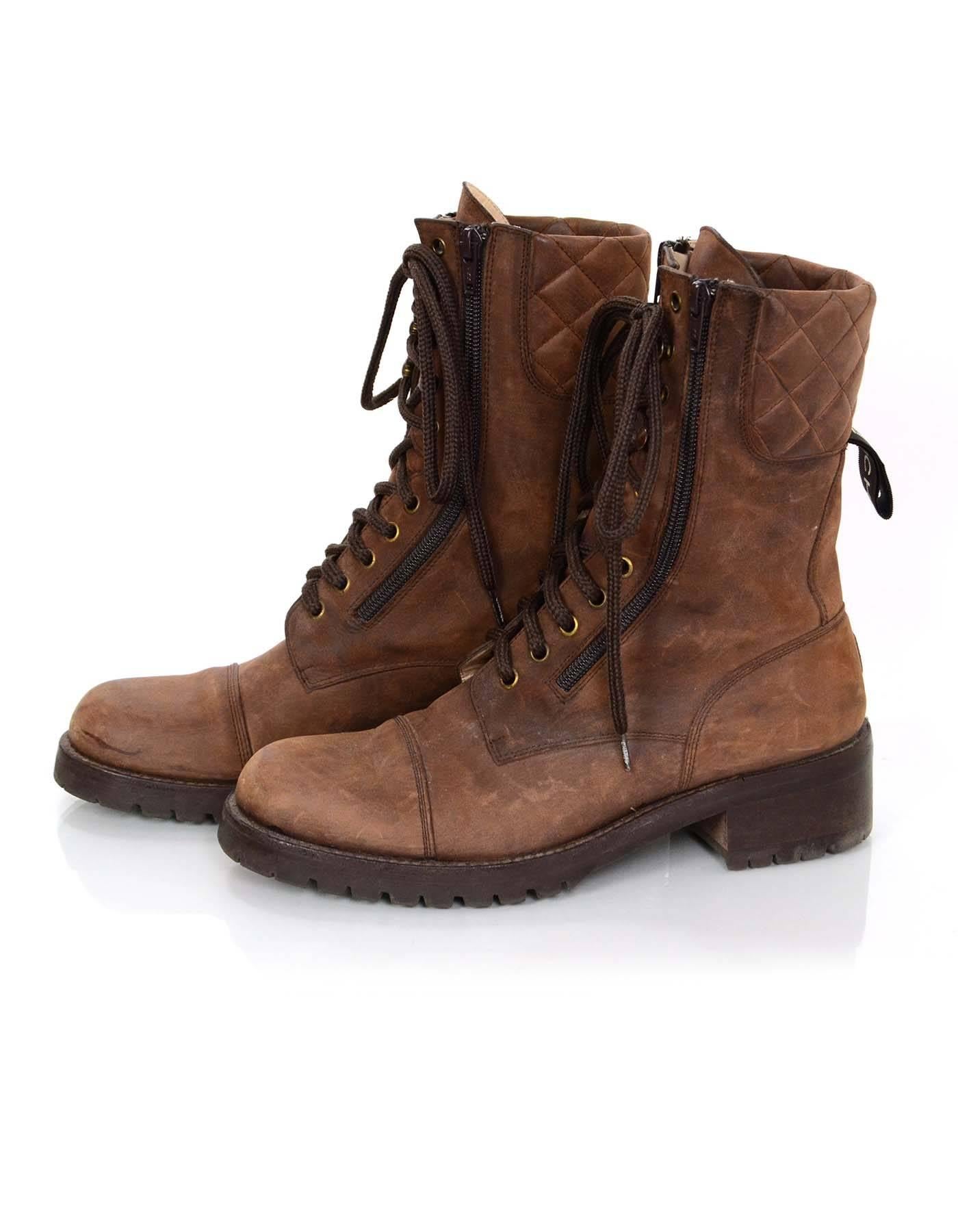 Chanel Brown Vintage Combat Boots Sz 40

Made In: Spain
Color: Brown
Materials: Suede, rubber
Closure/Opening: Double zip and lace-tie closure
Sole Stamp: Chanel made in spain
Overall Condition: Very good pre-owned vintage condition with the