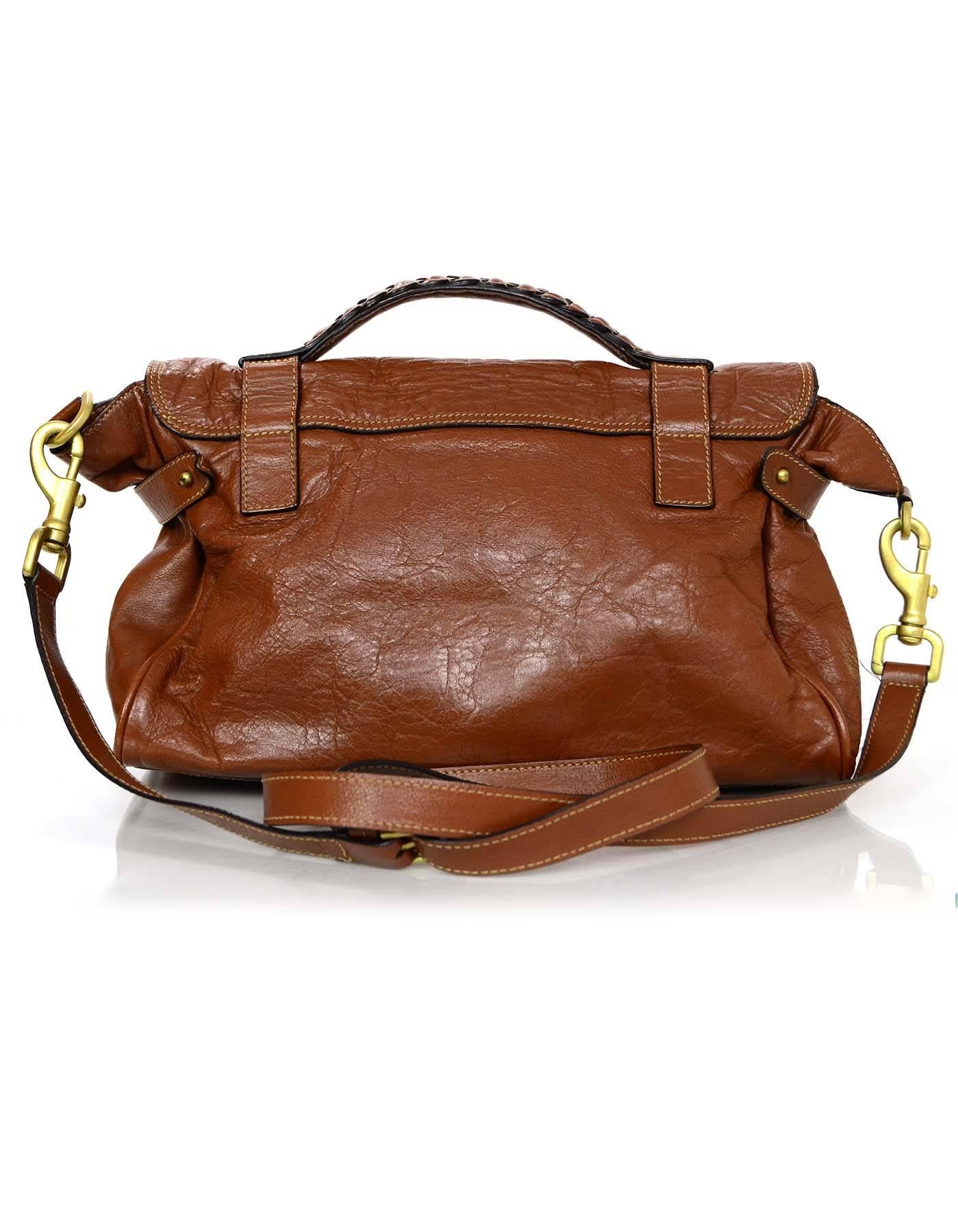 100% Authentic Mulberry Oak Leather Medium Alexa Satchel Bag. Features braided detail at handle and classic Mulberry twist lock. Optional long strap allows for crossbody use, making this a perfect everyday bag.

Made In: Turkey
Color:
