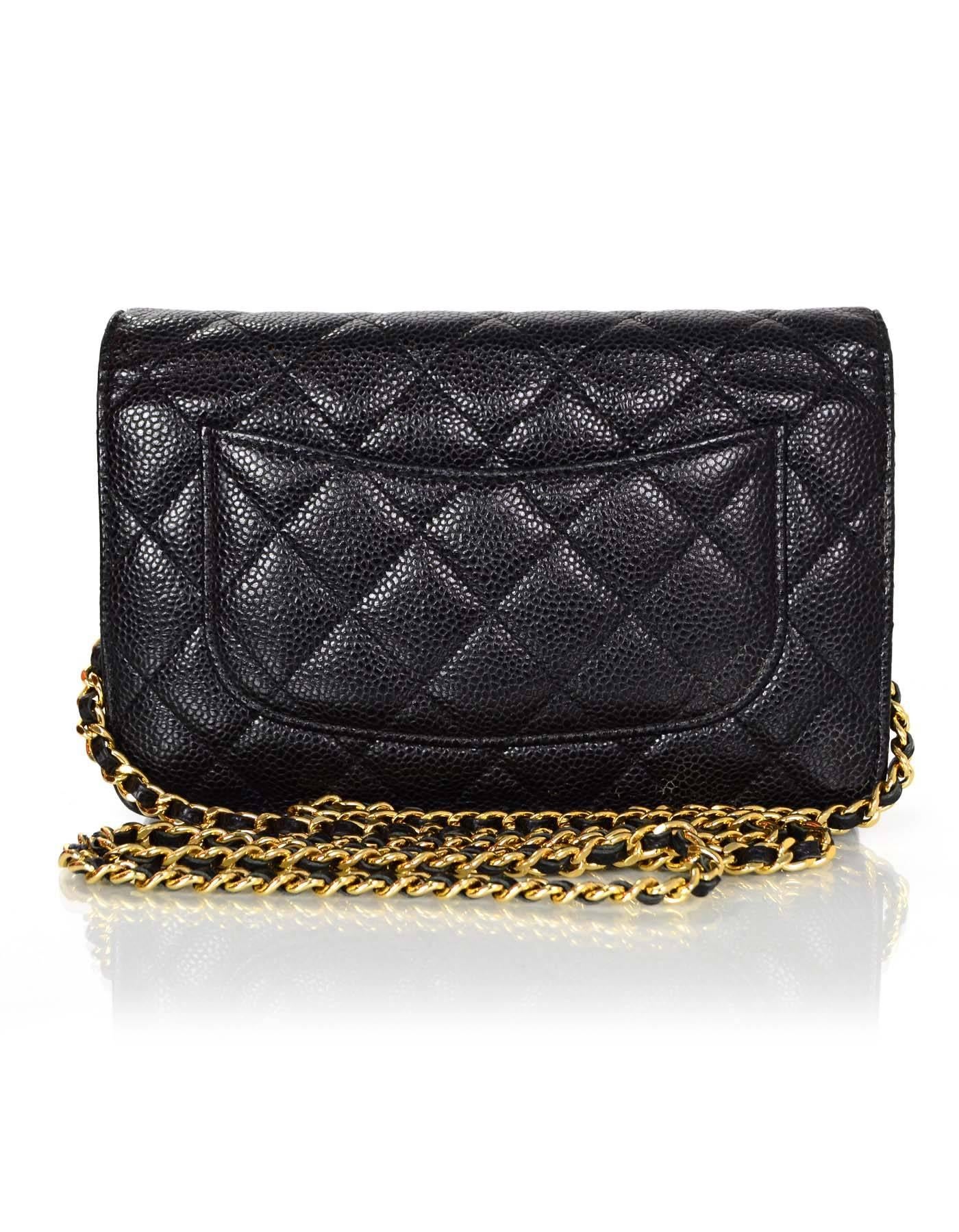 100% Authentic Chanel Black Caviar Leather WOC with Goldtone Hardware.  This classic quilted flap bag is perfect for a night out with a wallet inside to save space.  Crossbody chain can also be tucked into bag to be worn as a clutch

Made In: