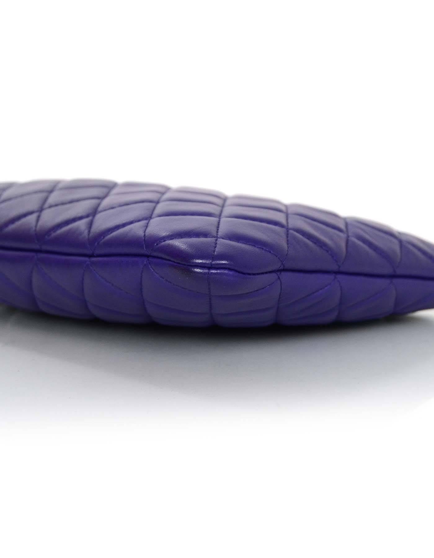 100% Authentic Chanel Purple Lambskin Leather Medium O Case. This classic quilted case is the perfect size to use as a clutch bag, or to hold an iPad or tablet. This piece is lined in purple nylon, so it can also be used as a cosmetic bag .

Made