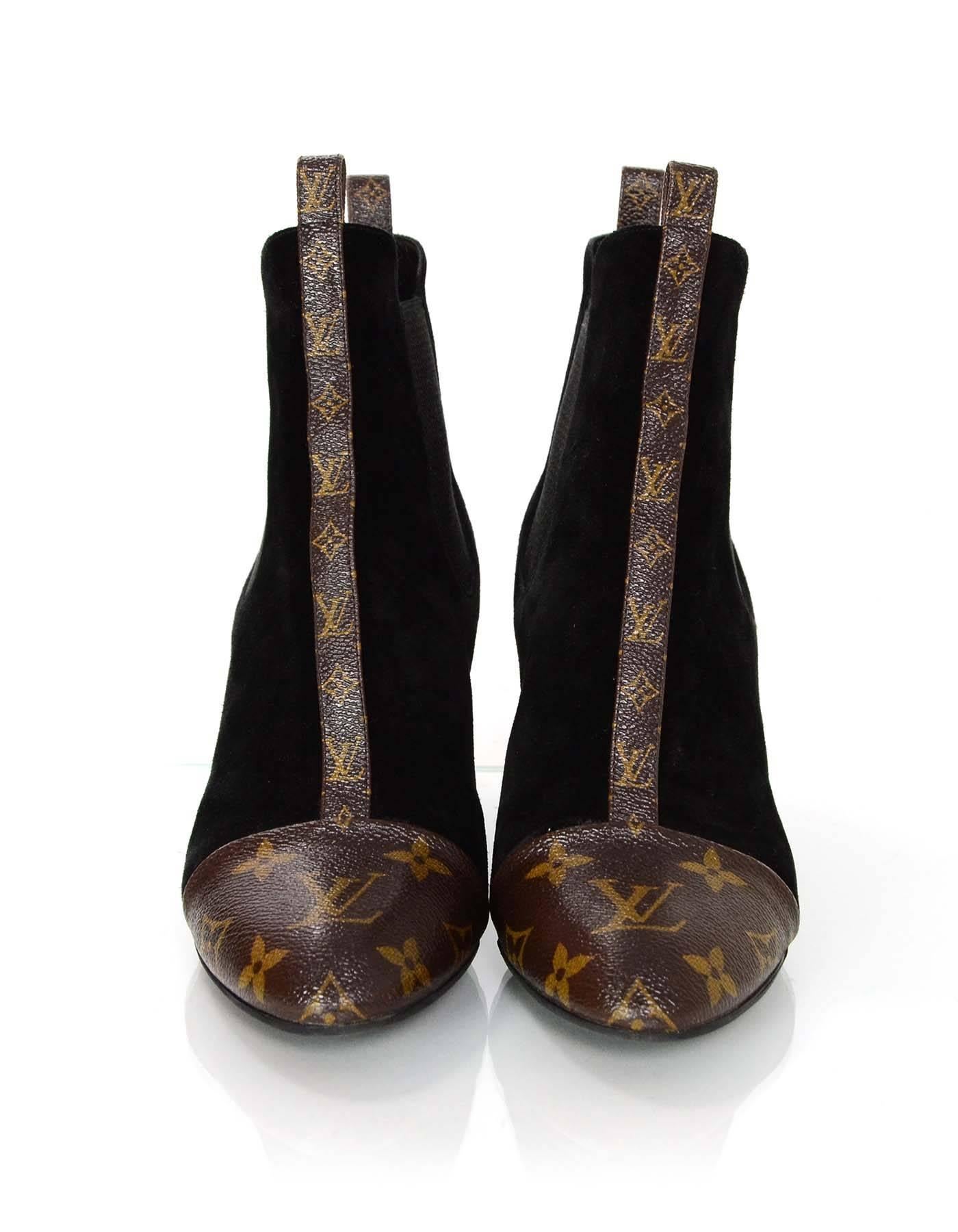 100% Authentic Louis Vuitton Revival Booties sz 36.5. These heeled ankle booties feature black suede with glazed monogram cap toe and trim.

Made In: Italy
Color: Black/brown
Materials: Coated canvas, suede, elastic
Closure/Opening: Slip in