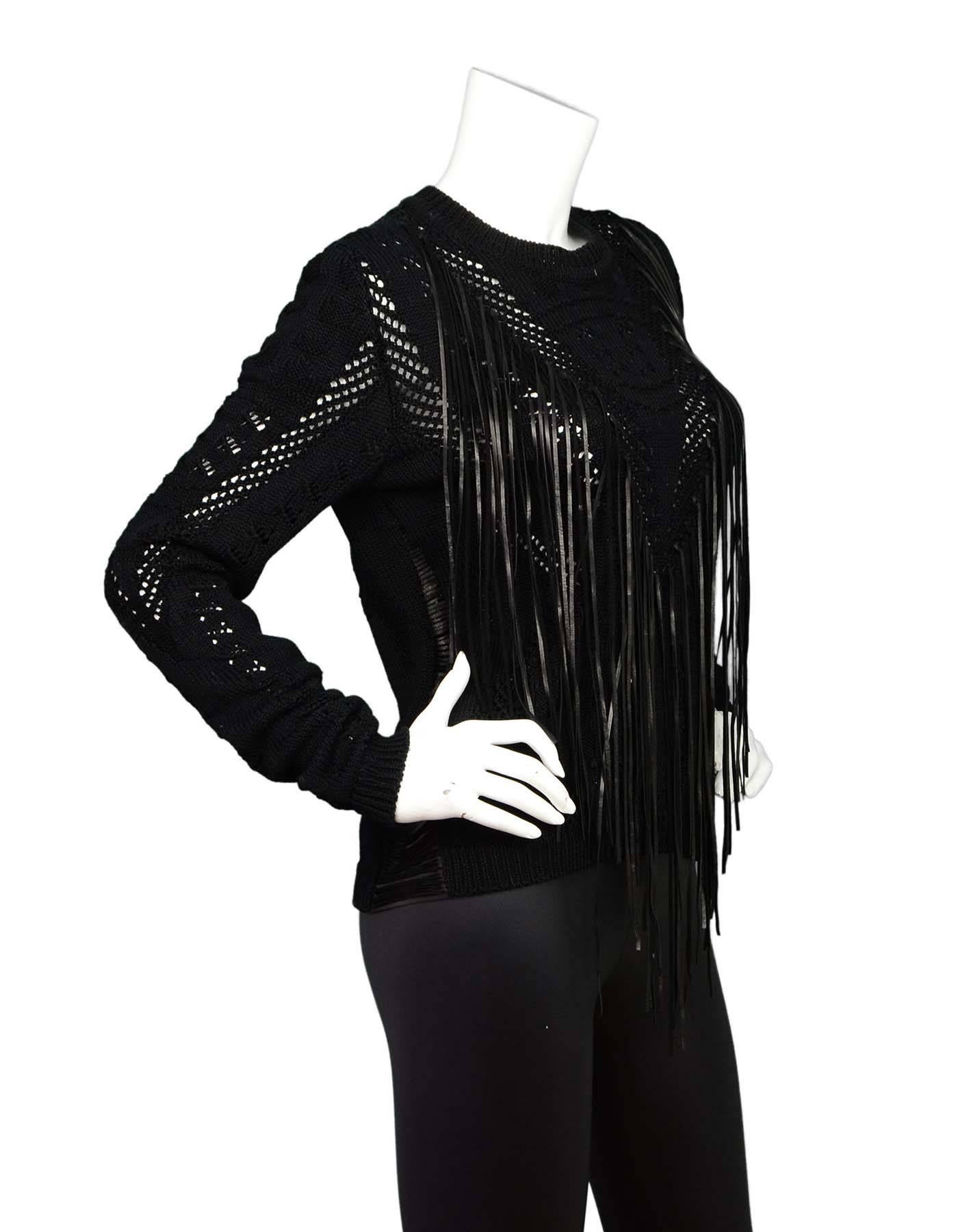 Roberto Cavalli Black Knit Sweater Sz 40
Features leather fringe at front

Made in: Italy
Color: Black
Composition: 84% cotton, 16% rayon
Lining: None
Retail Price: $1,300 + tax
Closure/Opening: Pull over
Overall Condition: Excellent