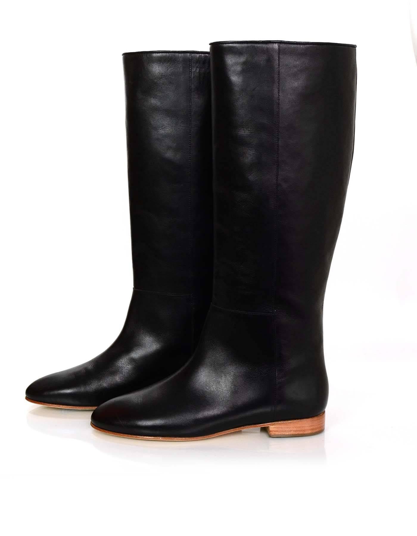 Loeffler Randall Black Leather Boots Sz 8

Made In: Brazil
Color: Black
Materials: Leather
Closure/Opening: Pull on
Sole Stamp: Loeffler Randall vero cuoio 8
Overall Condition: Excellent pre-owned condition with the exception of very light
