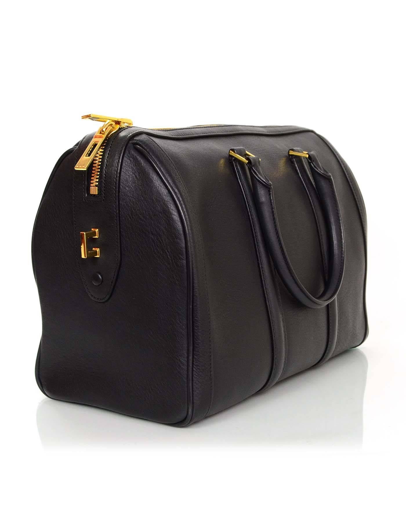 A.L.C. Black Leather Bowler Bag

Made In: China
Color: Black
Hardware: Goldtone
Materials: Leather and metal
Lining: Black textile
Closure/Opening: Double zip top closure
Exterior Pockets: One at side
Interior Pockets: One wall pocket and