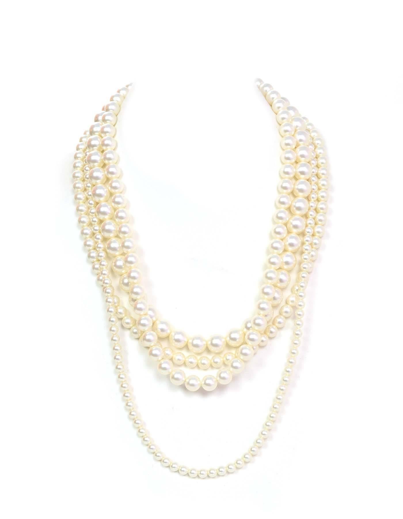 Lanvin 4 Strand Faux Pearl Necklace with dark grey crystal and faux pearl clasp

Made In: France
Color: Ivory, grey
Materials: Faux pearl, metal, crystal
Closure: Spring ring closure
Stamp: Lanvin Paris Made in France
Retail Price: $1,000 +
