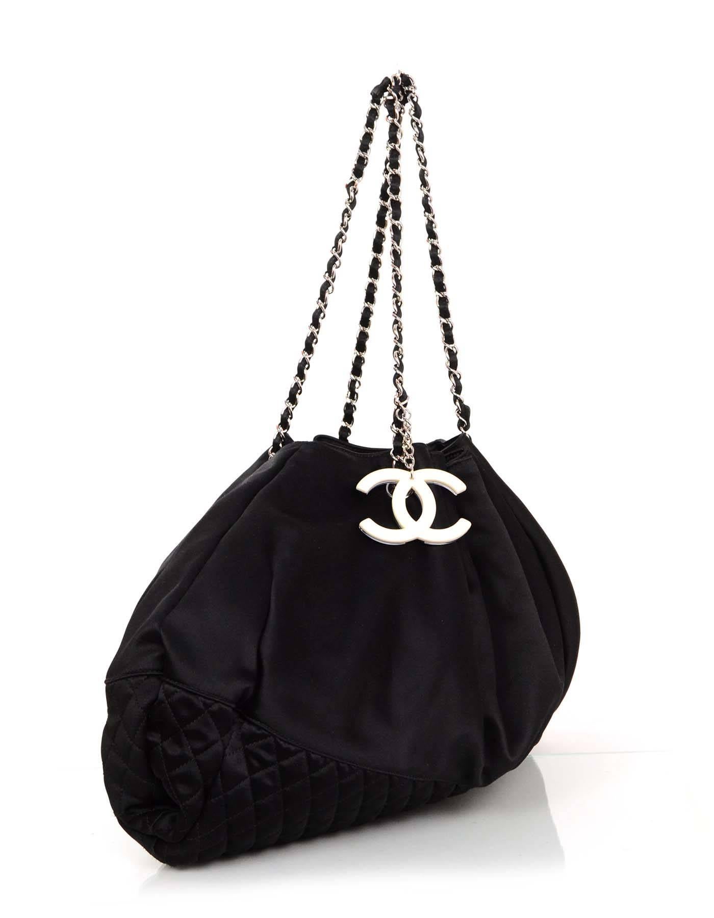 100% Authentic Chanel Black Satin Melrose Cabas Tote. Features bottom border quilting and satin laced classic chain straps. Black and ivory resin CC charm attached to front strap of bag.

Made In: Italy
Year of Production: 2008
Color: