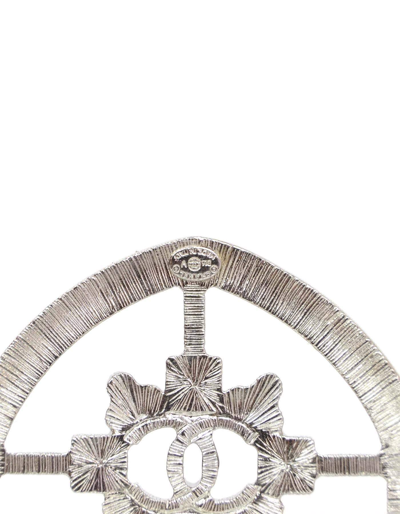 100% Authentic Chanel Silvertone Crystal Shield Brooch.  Features CC and CHANEL encased in a shield shape with baguette crystal border.

Made In: Italy
Year Of Production: 2016
Color: Silvertone
Materials: Metal and crystals
Closure: Pin back