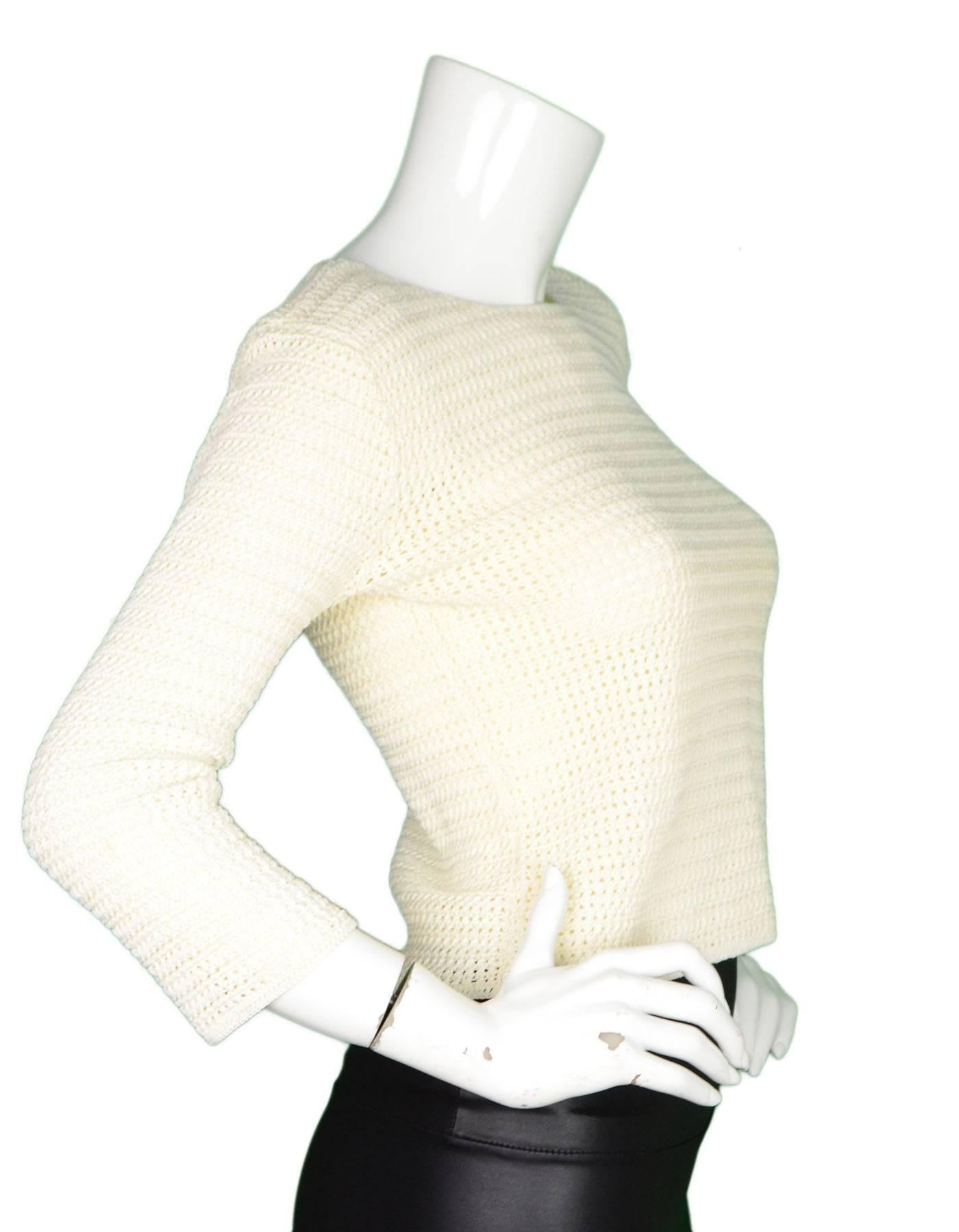 Chanel Cream Crochet Top Sz 38

Made In: France
Year Of Production: 2001
Color: Cream
Composition: 57% Rayon, 43% Cotton
Lining: None
Closure/Opening: Pull over
Overall Condition: Excellent pre-owned condition with the exception of very