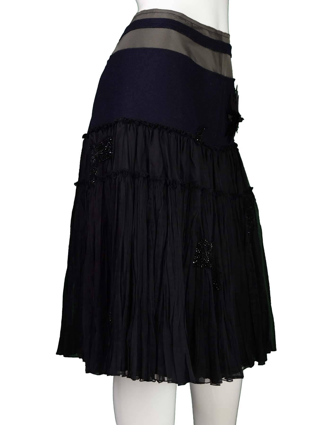 Prada Black and Navy Beaded Skirt Sz 44
Features beading throughout skirt

Made In: Italy
Color: Black, navy, grey
Composition: 100% Silk, 100% Wool
Lining: Black textile
Closure/Opening: Hidden side zip closure
Overall Condition: Very good