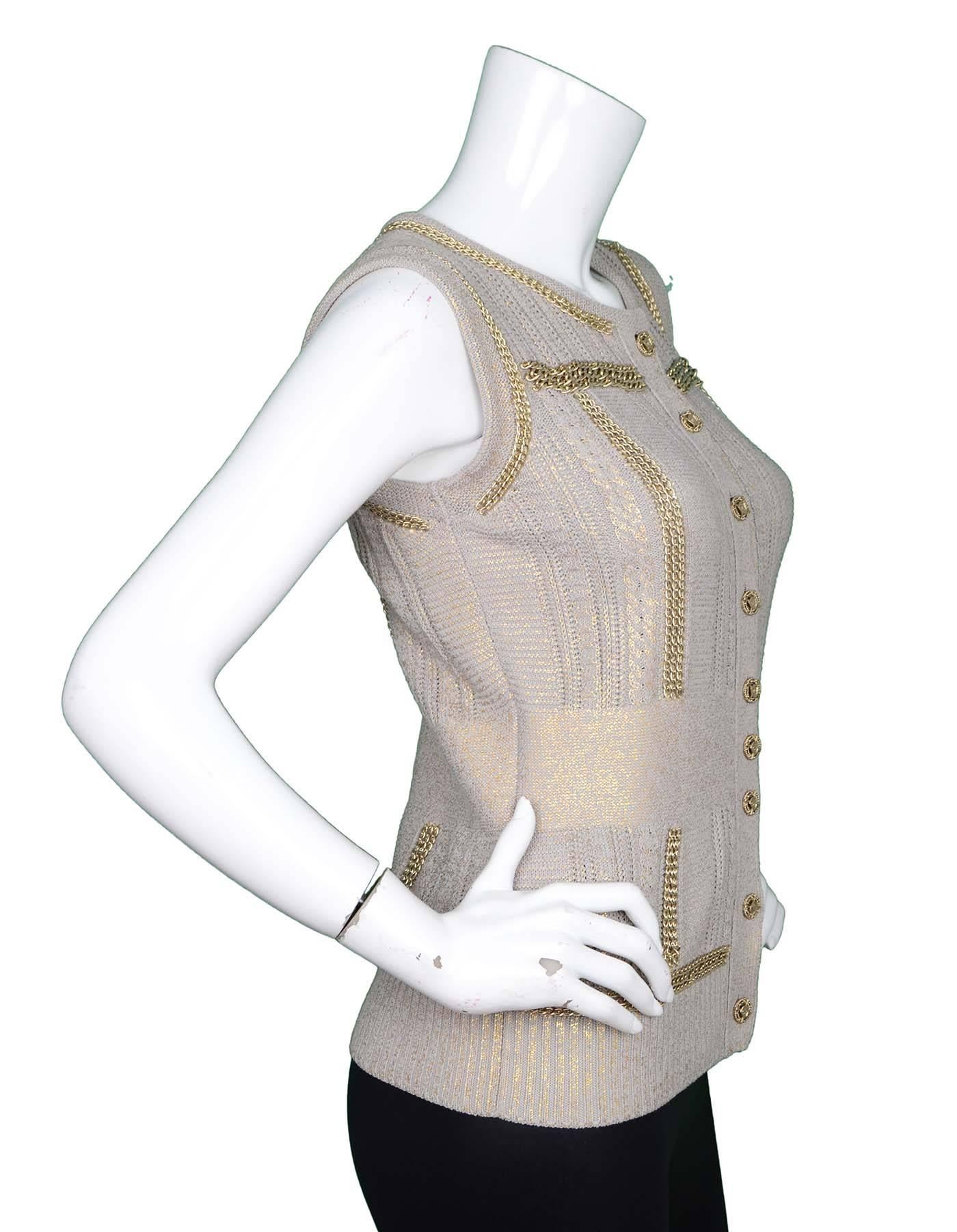 Chanel Taupe and Gold Vest Sz 38
Features goldtone chain link trim and coated gold metallic detail throughout

Made In: Italy
Year Of Production: 2008
Color: Taupe and gold
Composition: 56% Rayon, 44% Cotton
Lining: None
Closure/Opening: