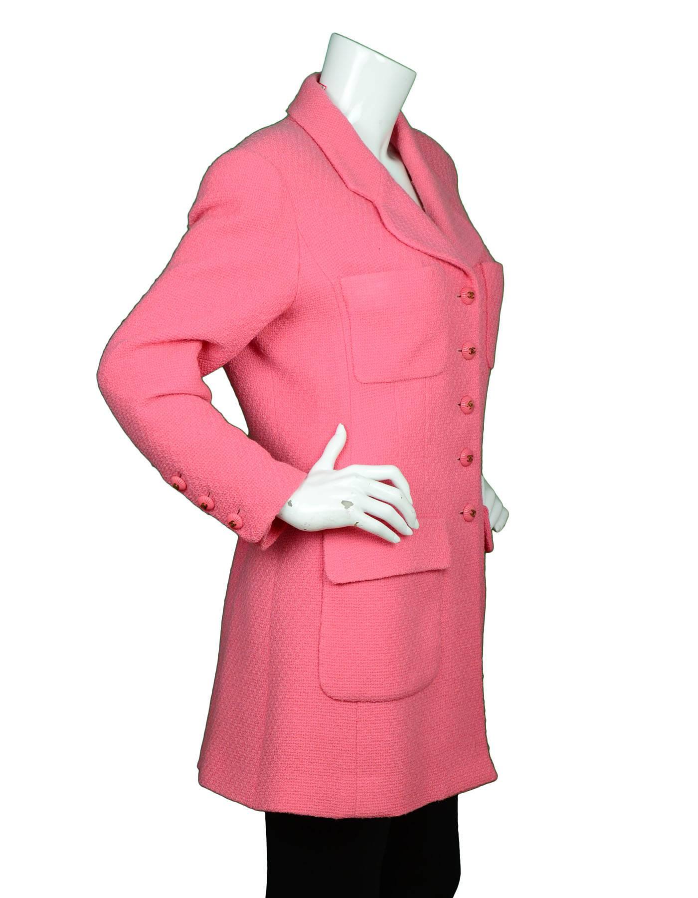 Chanel Pink Boucle Jacket

Color: Pink
Lining: Pink textile
Closure/Opening: Front button closure
Exterior Pockets: Four patch pockets
Interior Pockets: None
Overall Condition: Very good pre-owned condition with the exception at interior