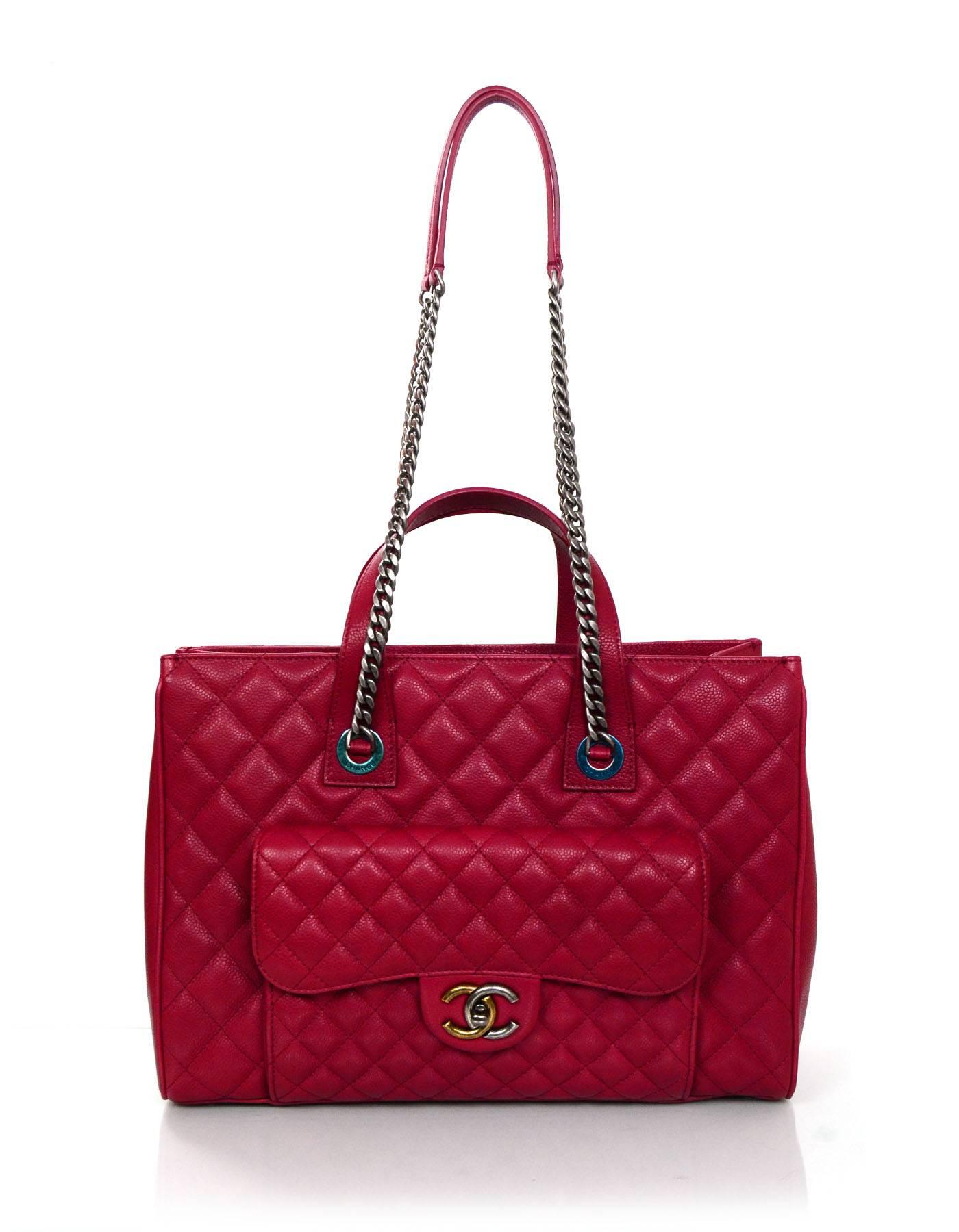 Chanel NEW Red Caviar Leather Tote
Features front flap pocket that closes with a two tone antiqued CC twist lock

Made In: Italy
Year of Production: 2016
Color: Red
Hardware: Antique silvertone and goldtone
Materials: Caviar leather,