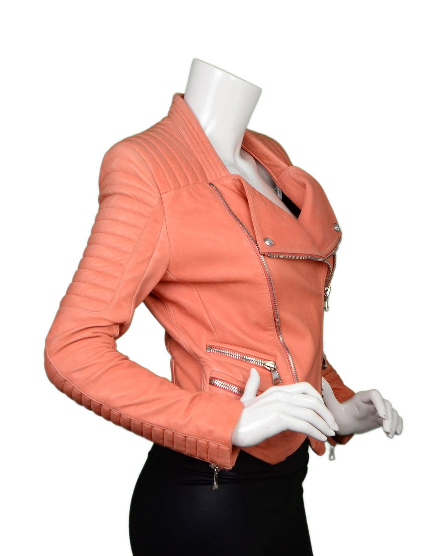 Balmain Salmon Padded Leather Moto Jacket sz FR36
Features padding throughout shoulders and sleeves

Made In: Turkey
Color: Salmon
Composition: 100% lambskin
Lining: Black, 52% viscose, 48% cotton
Closure/Opening: Zip up front
Exterior