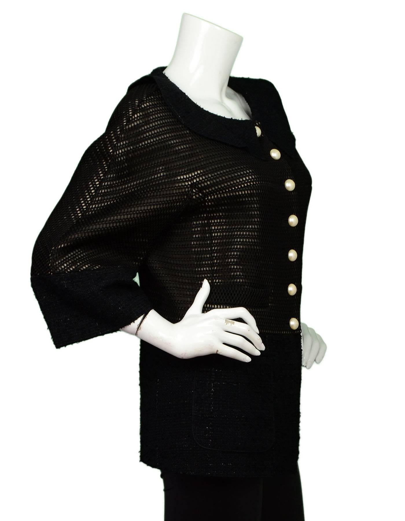 Chanel Black 3/4 Sleeve Swing Jacket
Features taupe inlay and pearl buttons

Made In: France
Color: Black
Composition: 100% nylon 
Lining: Black, 100% silk
Closure/Opening: Button front closure
Exterior Pockets: Four front patch
