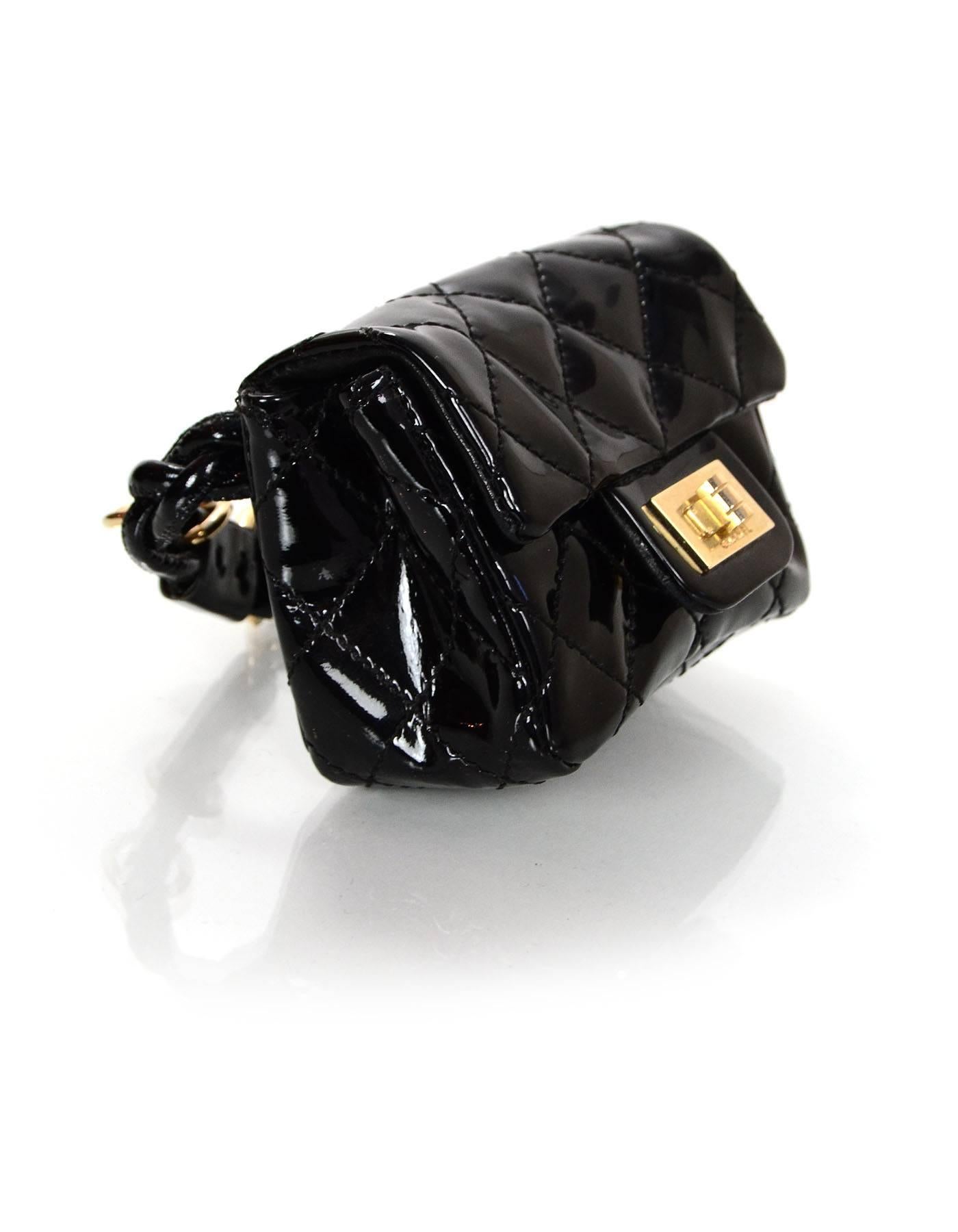 Chanel Black Quilted Patent Re-Issue Ankle Bag 
Features adjustable patent braided strap so can be worn as ankle or wrist bag

Made In: France
Year of Production: 2007
Color: Black
Hardware: Light goldtone
Materials: Patent leather
Lining: