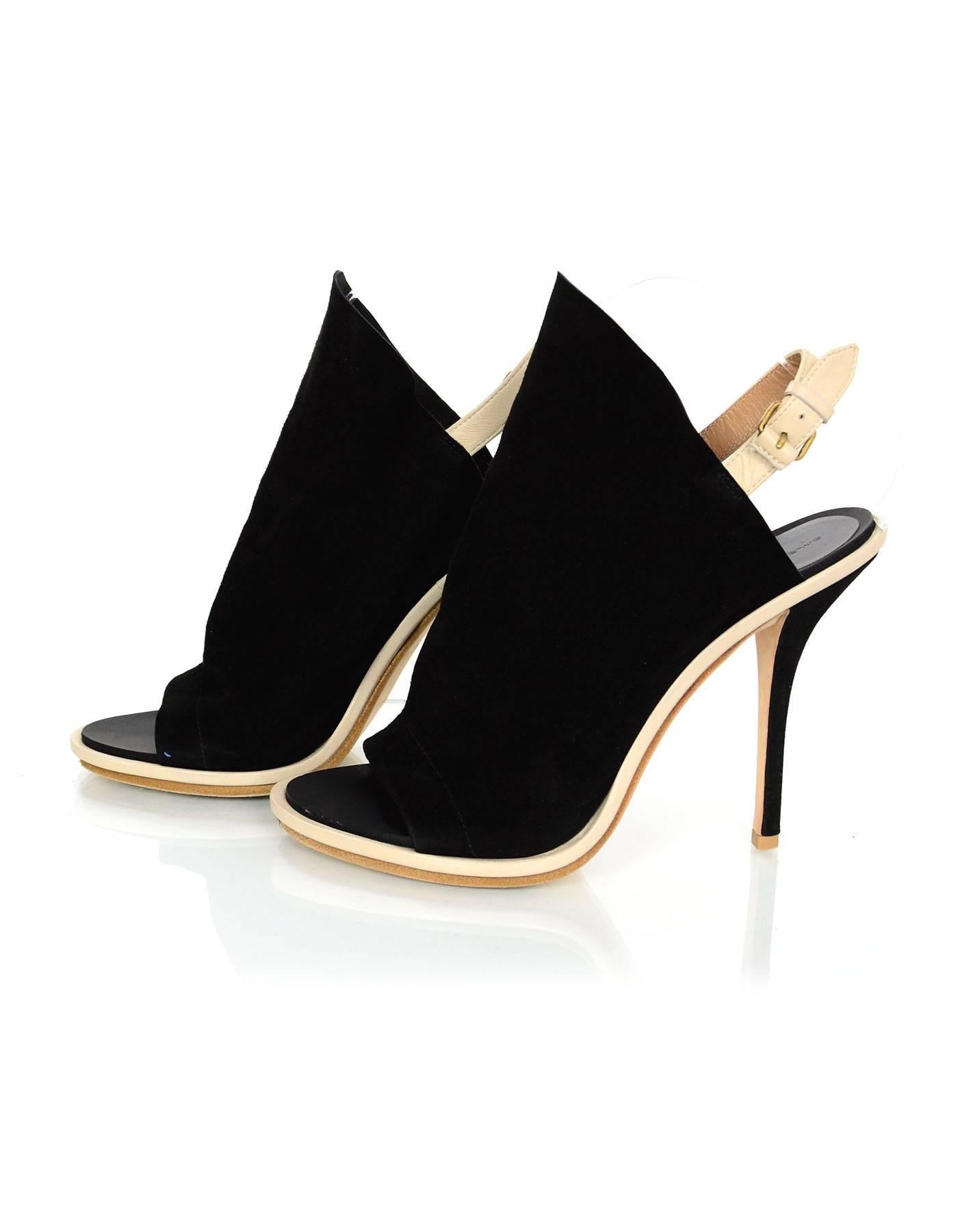 Balenciaga Black Suede Glove Open-Toe Sandals Sz 39

Made In: Italy
Color: Black and cream
Materials: Suede, leather
Closure/Opening: Buckle closure at ankle 
Sole Stamp: Balenciaga 39 Made in Italy
Retail Price: $735 + tax
Overall