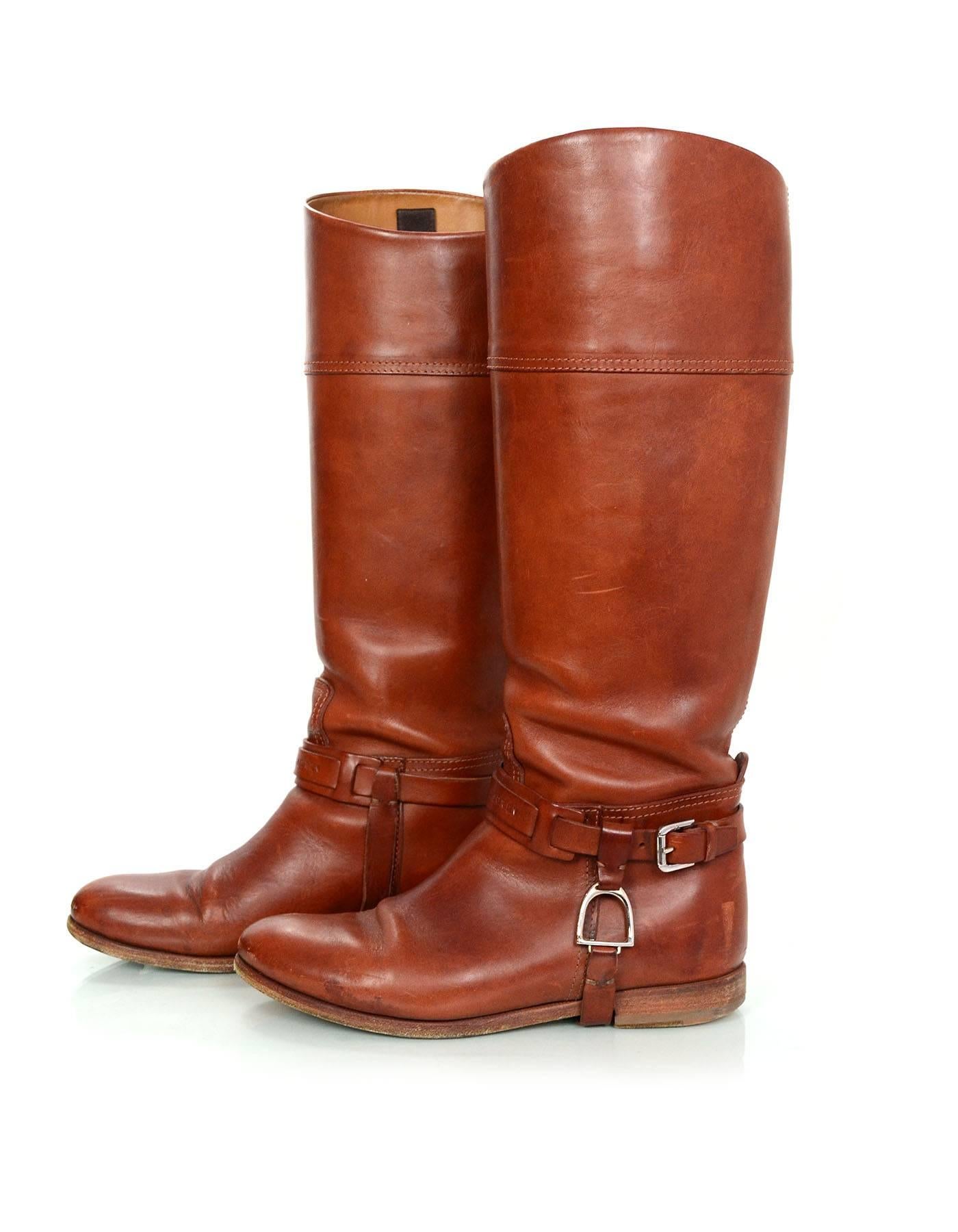 Ralph Lauren Cognac Leather Riding Boots Sz 6.5
Features buckle detail at ankles

Made In: Italy
Color: Cognac
Materials: Leather
Closure/Opening: Pull on 
Sole Stamp: Made in Italy 6.5
Overall Condition: Very good pre-owned condition with
