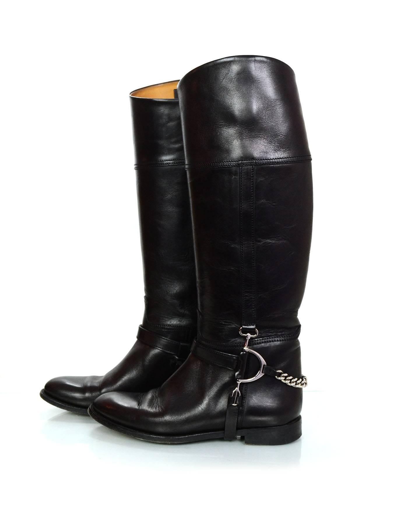 Ralph Lauren Black Leather Riding Boots Sz 6.5
Features buckle and chain detail at ankles

Made In: Italy
Color: Black
Materials: Leather, metal
Closure/Opening: Pull on 
Sole Stamp: Ralph Lauren Collection Made in Italy 6.5
Overall