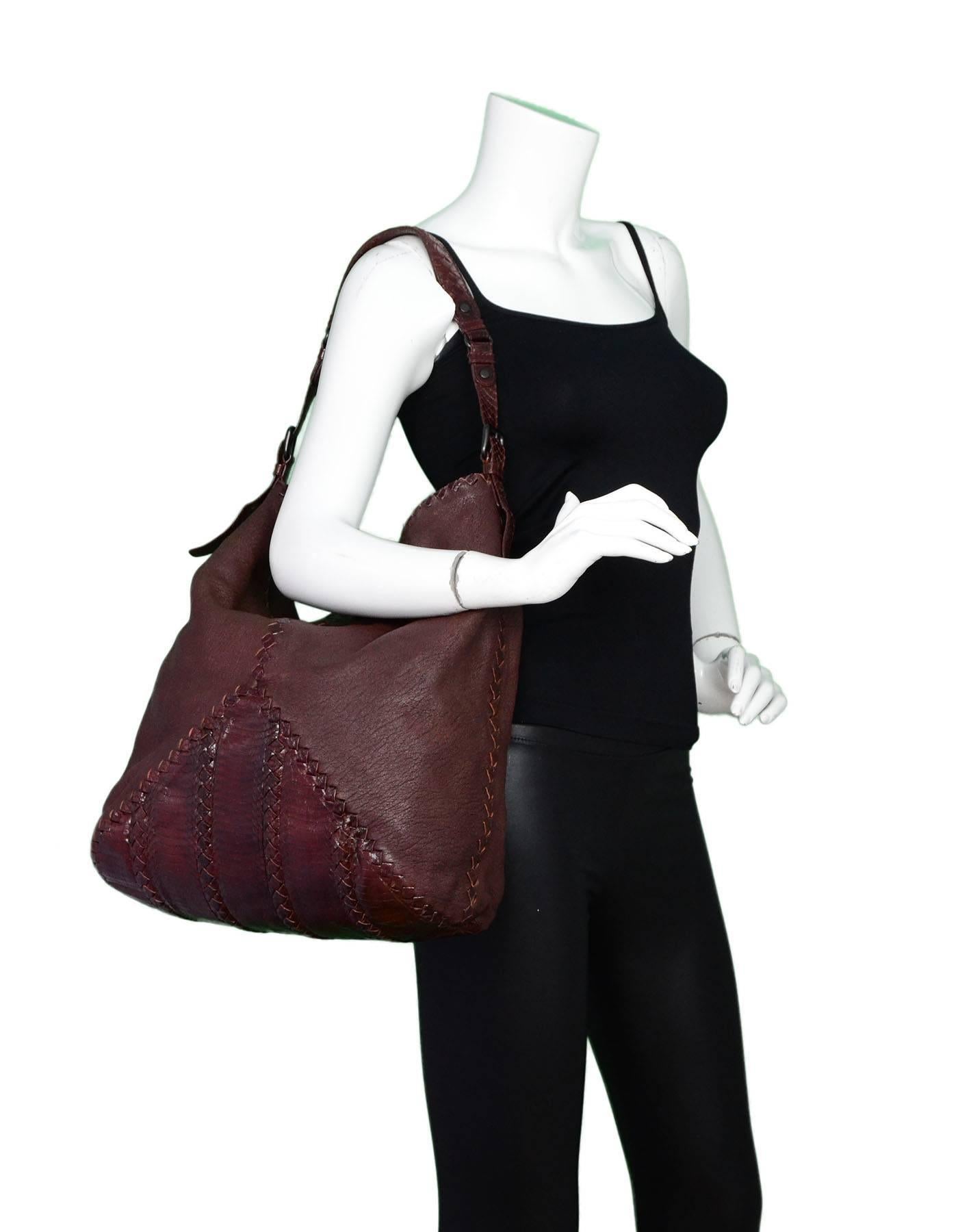 Bottega Veneta Brown Leather and Python Hobo Tote
Features intrecciato trim throughout

Made In: Italy
Color: Brown
Hardware: Matte black
Materials: Leather, python, metal
Lining: Taupe suede
Closure/Opening: Open top
Exterior Pockets: