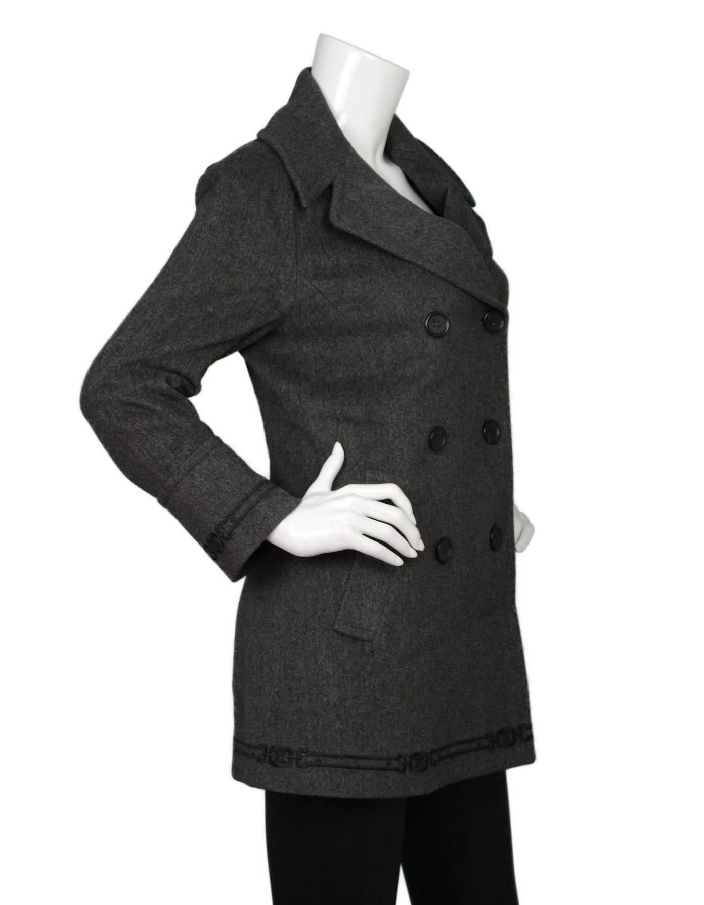 Celine Grey Wool Pea Coat Sz 38
Features double breasted button closure and embroidered detail at sleeves and trim

Made In: France
Color: Grey
Composition: 100% wool
Lining: Grey 100% acetate
Closure/Opening: Double breasted button front