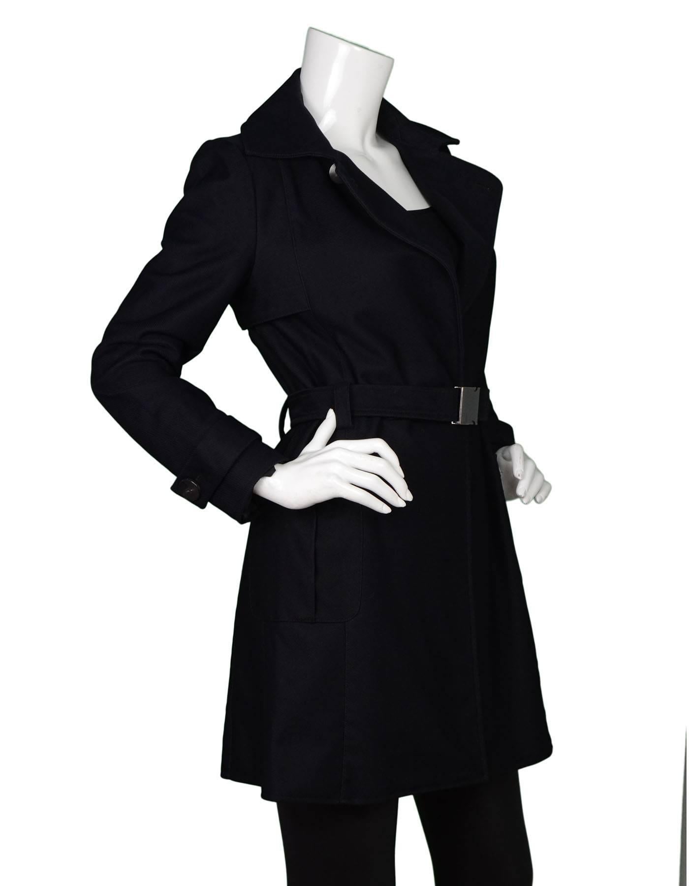 Loewe Navy Trench Coat Sz 38
Features belt at waist

Made In: Spain
Color: Navy
Composition: Not listed, feels like wool blend
Lining: Black textile
Closure/Opening: Front hidden button closure and belt at waist
Exterior Pockets: Two hip zip