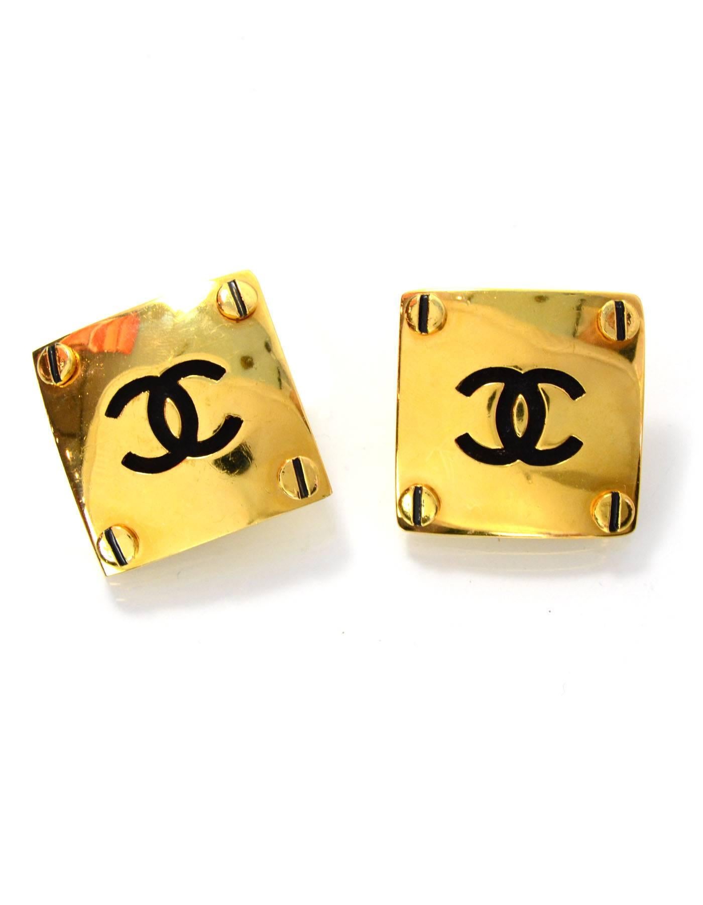 Chanel XL Square CC Clip On Earrings
Features CC's in center and four bolt details in all corners
Made In: France
Year of Production: 1989
Color: Goldtone and black
Materials: Metal 
Closure/Opening: Clip on back
Serial Number/Date Stamp: 2