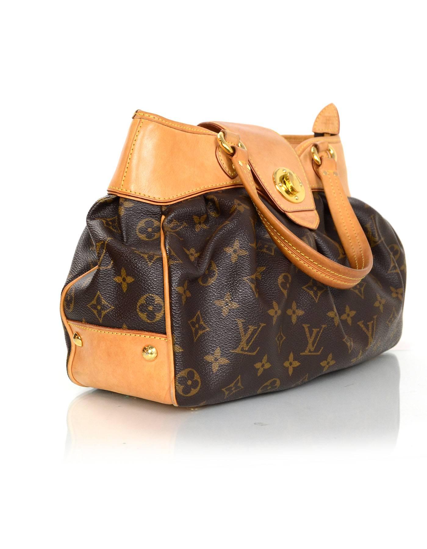 Louis Vuitton Monogram Boetie PM Bag
Features tan leather trim throughout

Made In: France
Year of Production: 2009
Color: Brown and tan
Hardware: Goldtone
Materials: Coated canvas and leather
Lining: Nude microfiber
Closure/Opening: Zip