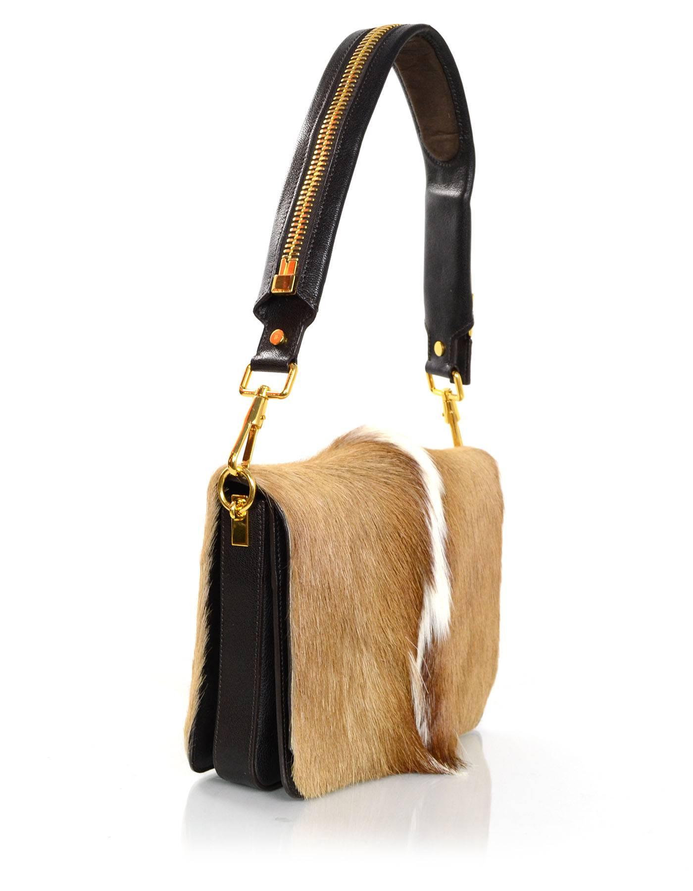 Tom Ford Antelope Fur & Brown Leather Bag 
Features large goldtone decorative zipper on shoulder strap

Made In: Italy
Color: Tan, white and dark brown
Hardware: Goldtone
Materials: Antelope fur and leather
Lining: Brown