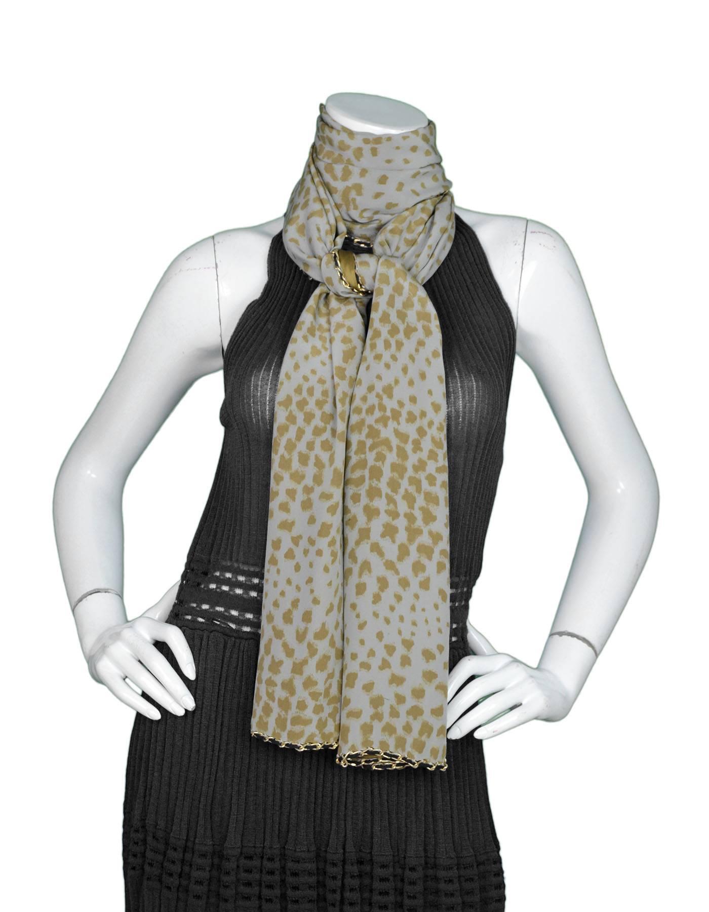 Chloe Animal Print Silk Large Scarf 
Features goldtone chain link trim throughout

Made In: India
Color: Grey and army green
Hardware: Goldtone
Composition: 100% silk
Overall Condition: Excellent pre-owned condition
Measurements: 
Length: