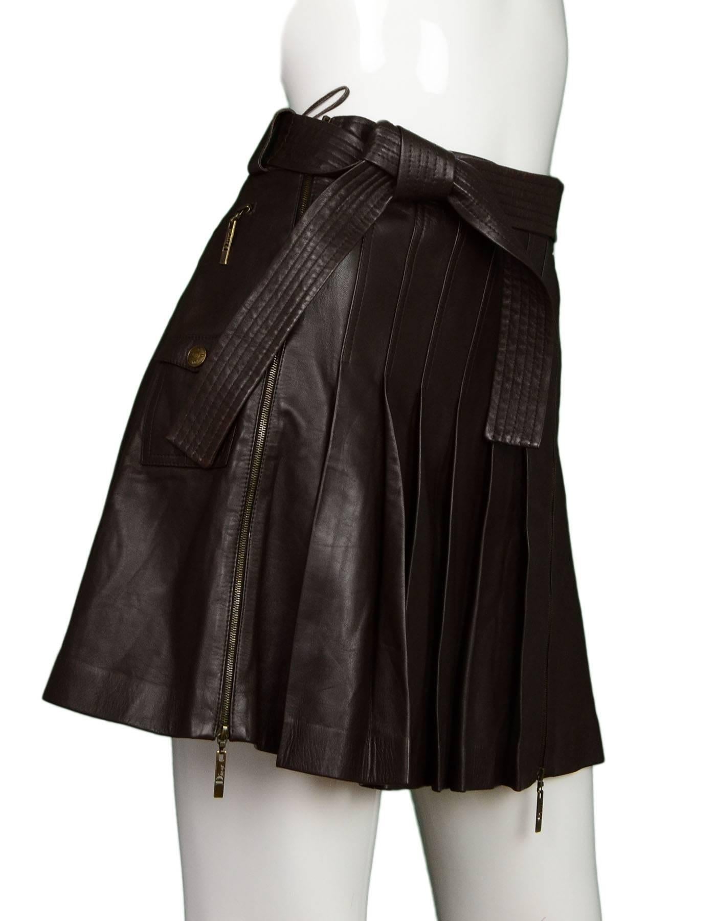 Christian Dior NWT Brown Leather Pleated Skirt 
Features waist tie belt

Made In: France
Color: Brown
Composition: 100% lambskin
Lining: Brown, 94% silk, 6%  lycra
Closure/Opening: Front double hip zippers
Exterior Pockets: One cargo pocket