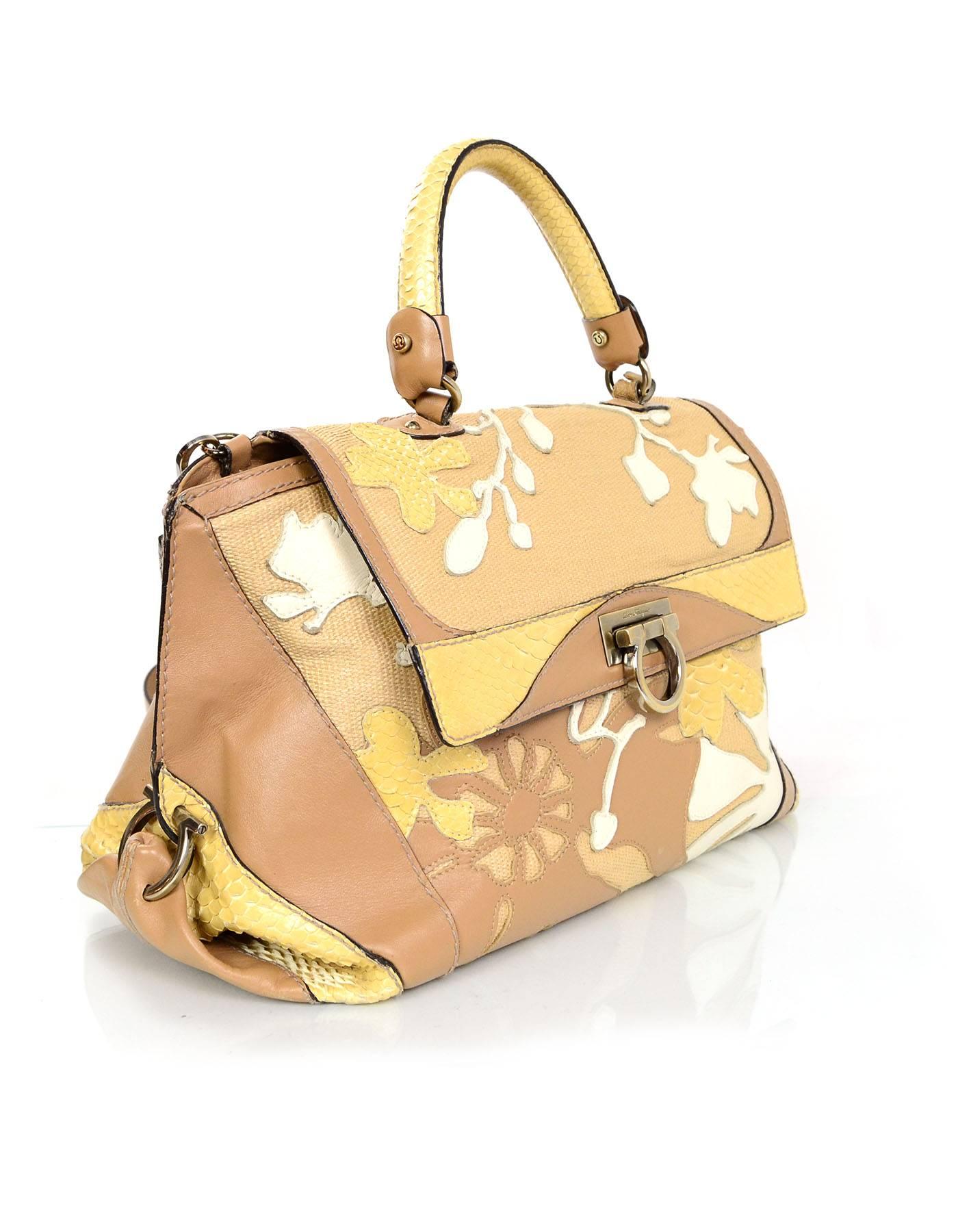 Salvatore Ferragamo Beige & Tan Sofia Satchel
Features flower and branch details stitched throughout
Made In: Italy
Color: Beige, tan and white
Hardware: Bronze
Materials: Leather, python, and woven canvas
Lining: Beige
