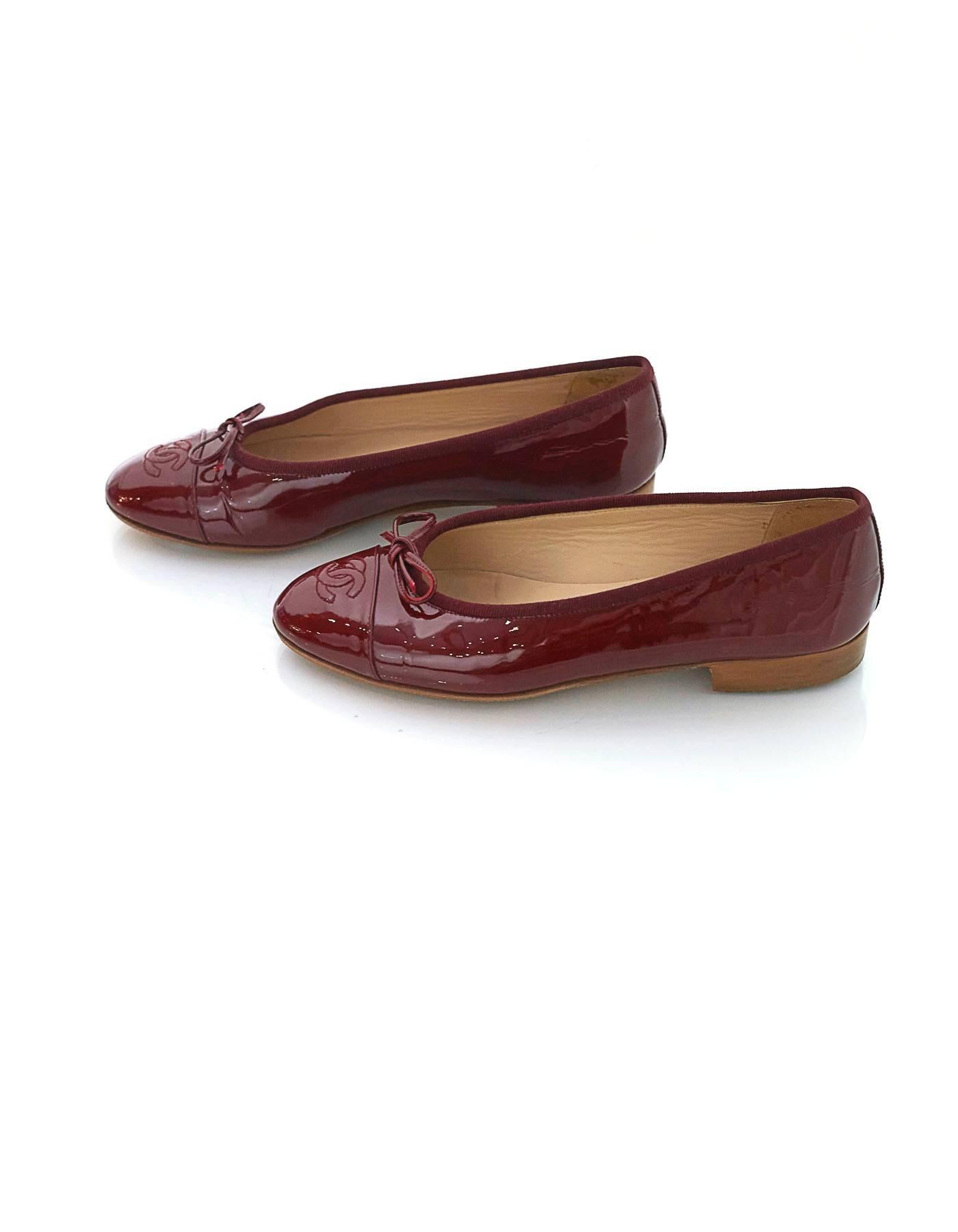 Chanel Burgundy Patent Ballet Flats
Features bow and CC stitched at toe cap

Made In: Italy
Color: Burgundy
Materials: Patent leather
Closure/Opening: Slide on
Sole Stamp: CC Made in Italy 36 1/2
Overall Condition: Excellent pre-owned