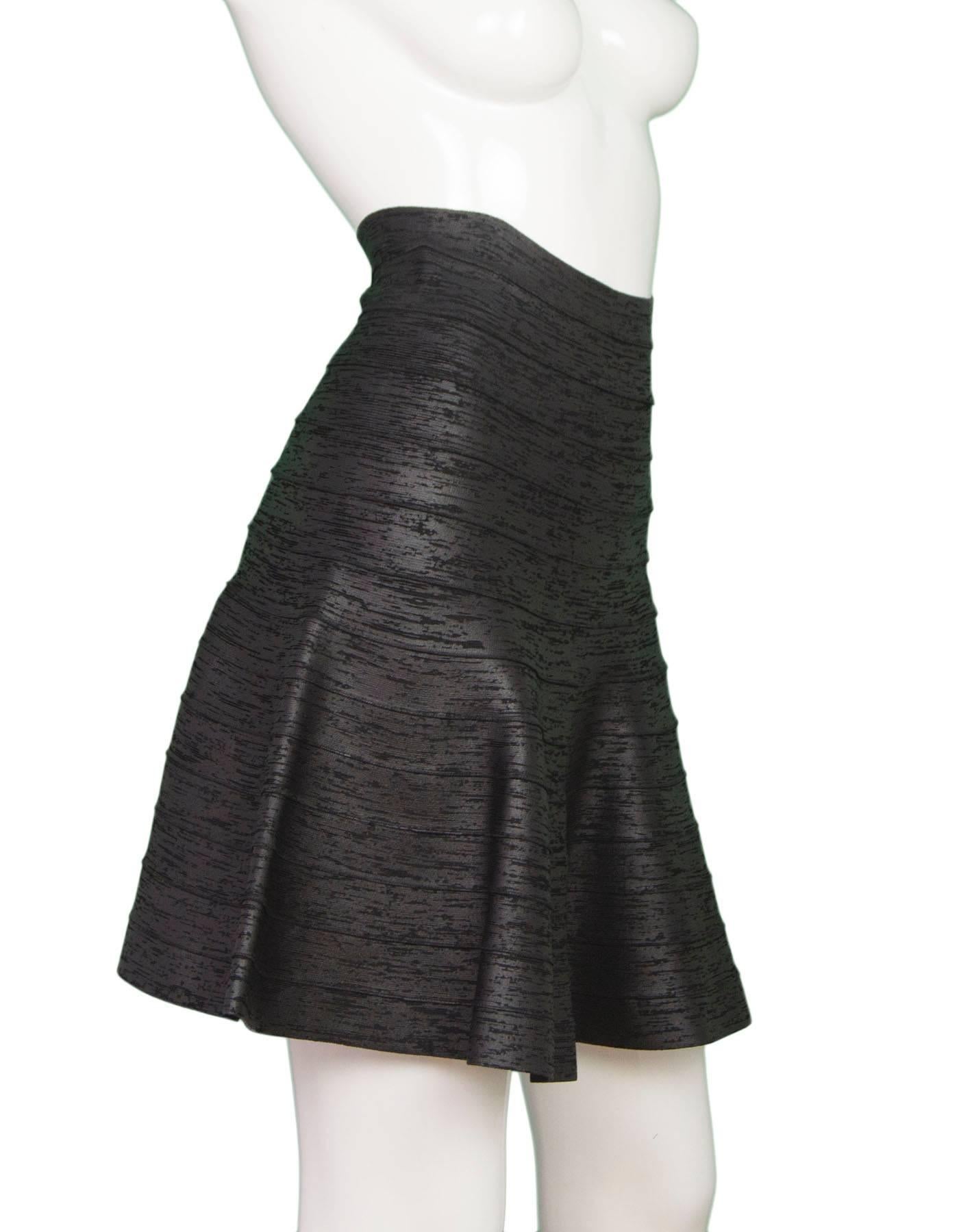 Herve Leger Iridescent Black A-Line Skirt 
Features bandage-style design with a-line shape

Made In: China
Color: Black
Composition: 90% rayon, 9% nylon, 1% spandex
Lining: None
Closure/Opening: Back center zipper closure with hook and eye