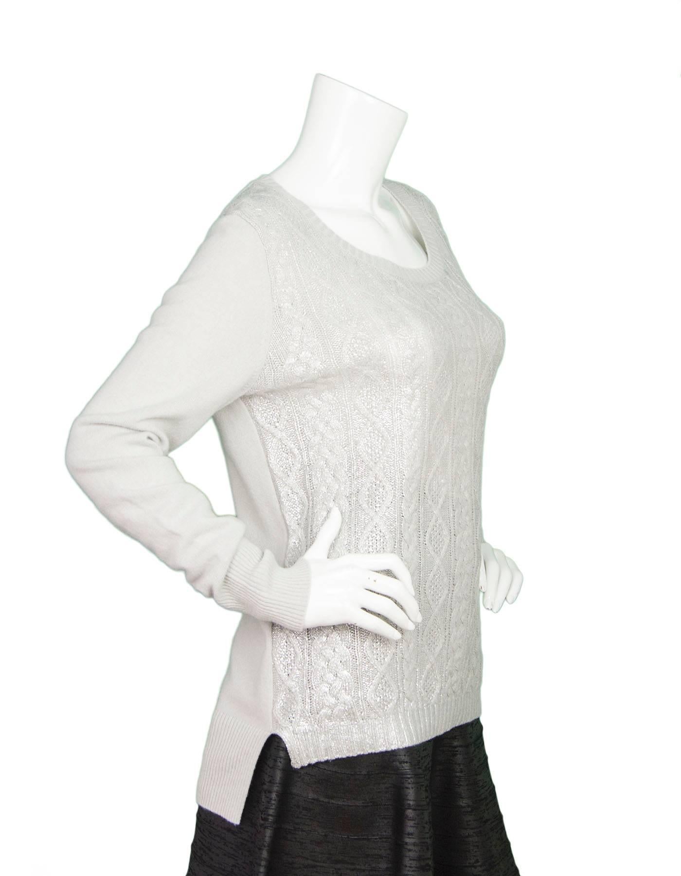 Christopher Fischer Grey & Silver Cashmere Sweater 
Features metallic silver painted over knit on front panel of sweater
Made In: China
Color: Grey and silver
Composition: 100% cashmere
Lining: None
Closure/Opening: Pull over
Exterior