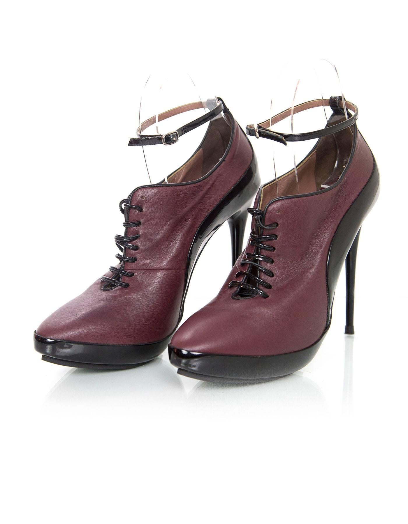 Tabitha Simmons Eggplant Leather Booties 
Features platform, patent ankle strap and patent laces

Made In: Italy
Color: Eggplant and black
Materials: Leather and patent leather
Closure/Opening: Ankle strap with buckle closure and lace up
Sole Stamp: