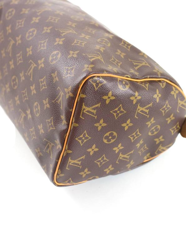 Sold at Auction: Louis Vuitton Speedy 30 Handbag - Monogram Empreinte, cream  leather, double strap handles, with padlock (no key), original box, label,  mini brochure. 30cm long, 22cm high.