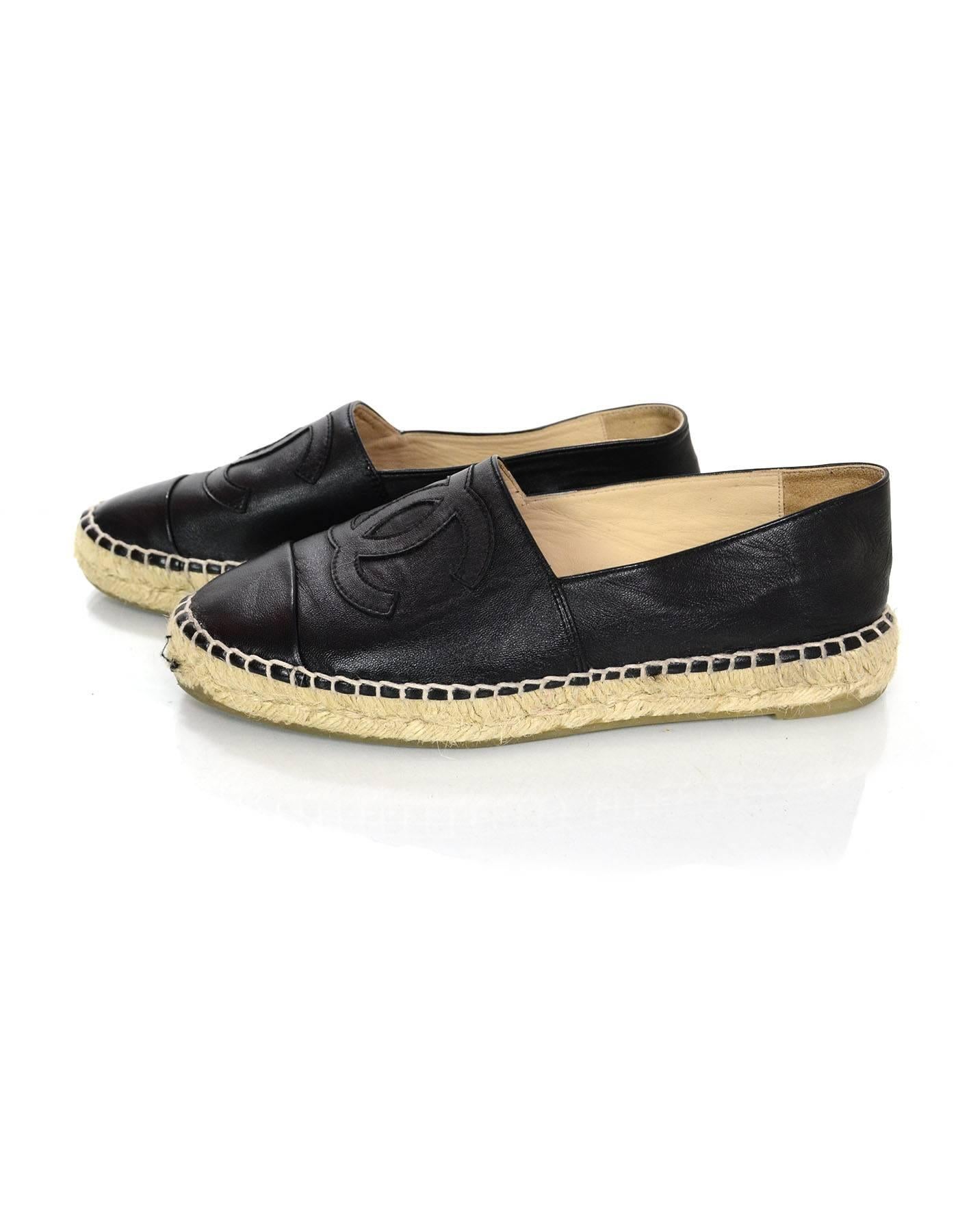 Chanel Black Lambskin Espadrilles 
Features stitched CC's on top of shoes

Made In: Spain 
Year Of Production: 2015
Color: Black and nude
Materials: Lambskin leather and jute rope
Closure/Opening: Slide on
Sole Stamp: 37 Made in Spain Chanel